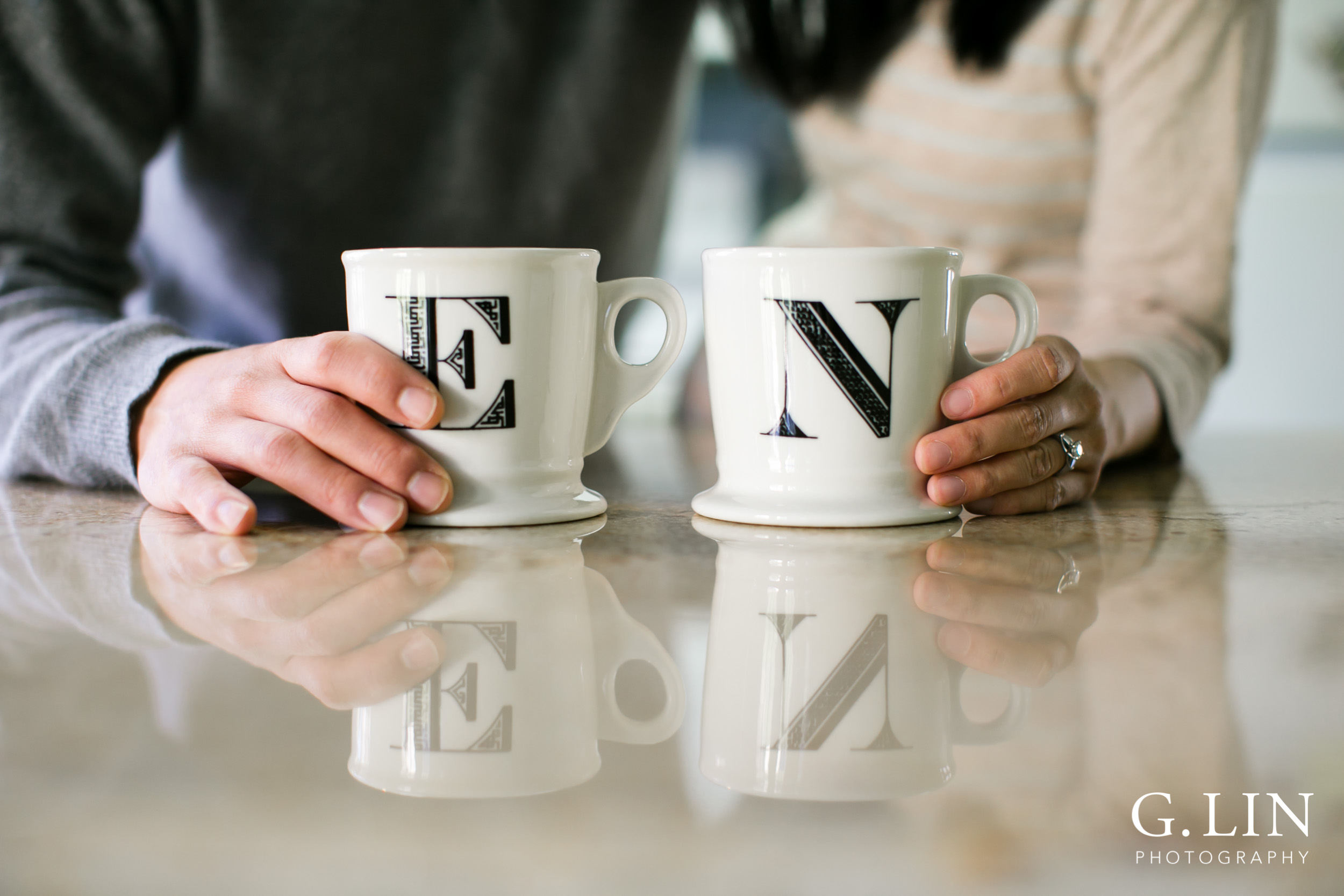Durham Maternity Photography | G. Lin Photography | Close up shot of couple holding mugs in kitchen