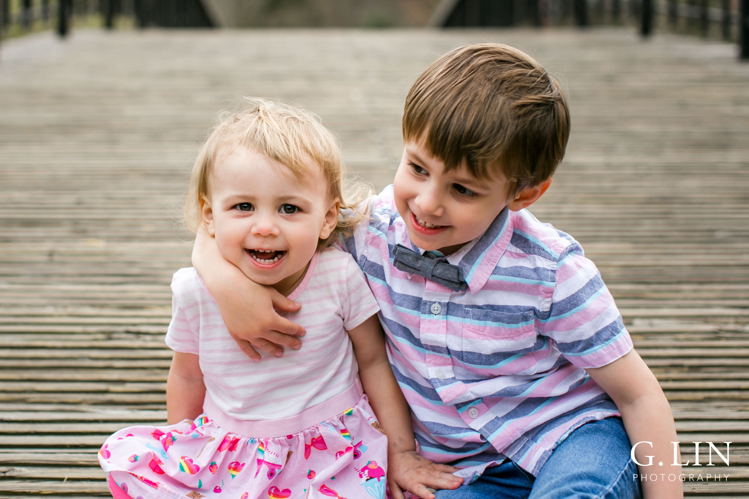 Raleigh Family Photographer | G. Lin Photography | Children sitting on ground smiling