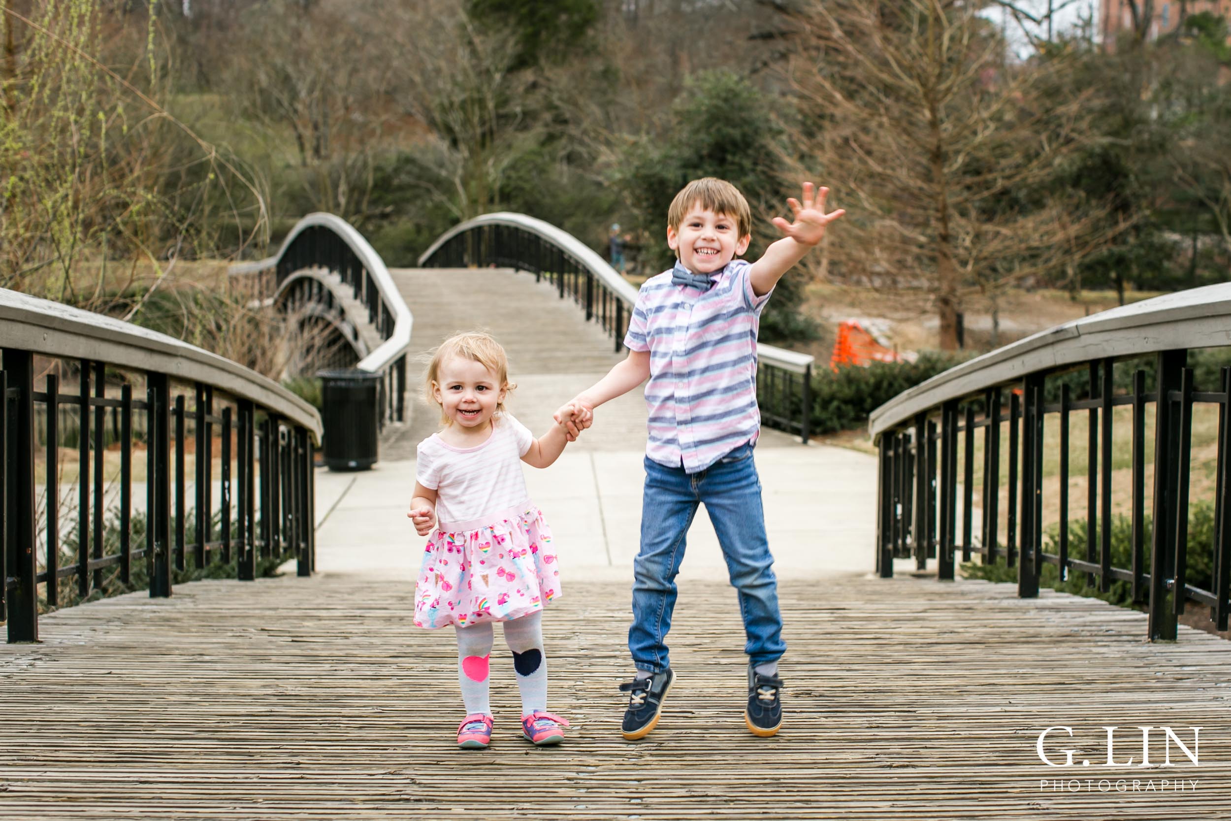 Raleigh Family Photographer | G. Lin Photography | Children holding hands and jumping