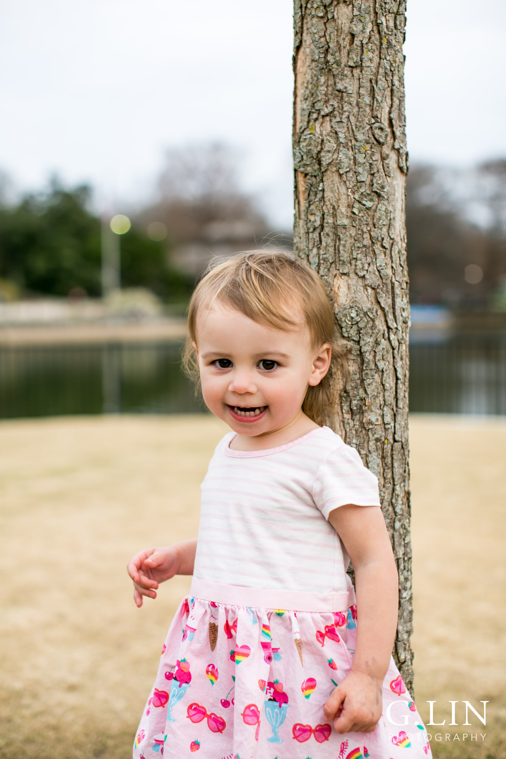 Raleigh Family Photographer | G. Lin Photography | Girl standing in field and smiling