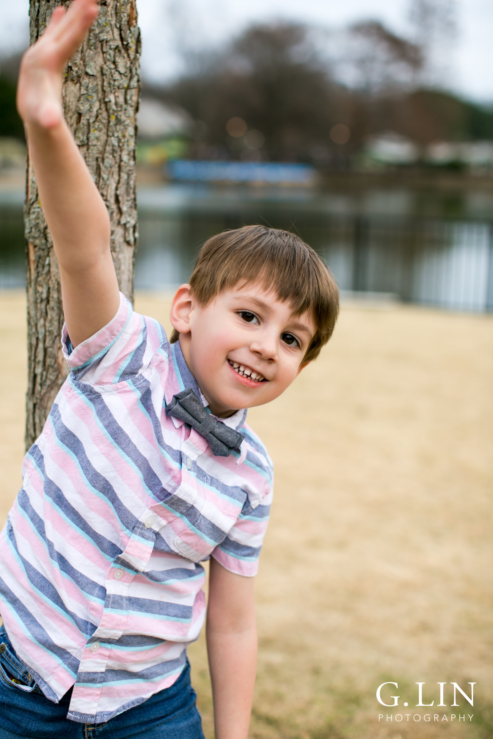 Raleigh Family Photographer | G. Lin Photography | Boy standing next to tree and smiling