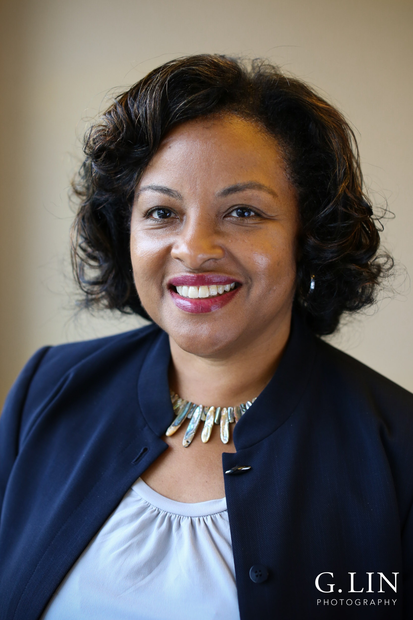 Raleigh Event Photographer | G. Lin Photography | Female participant smiling at camera for portrait