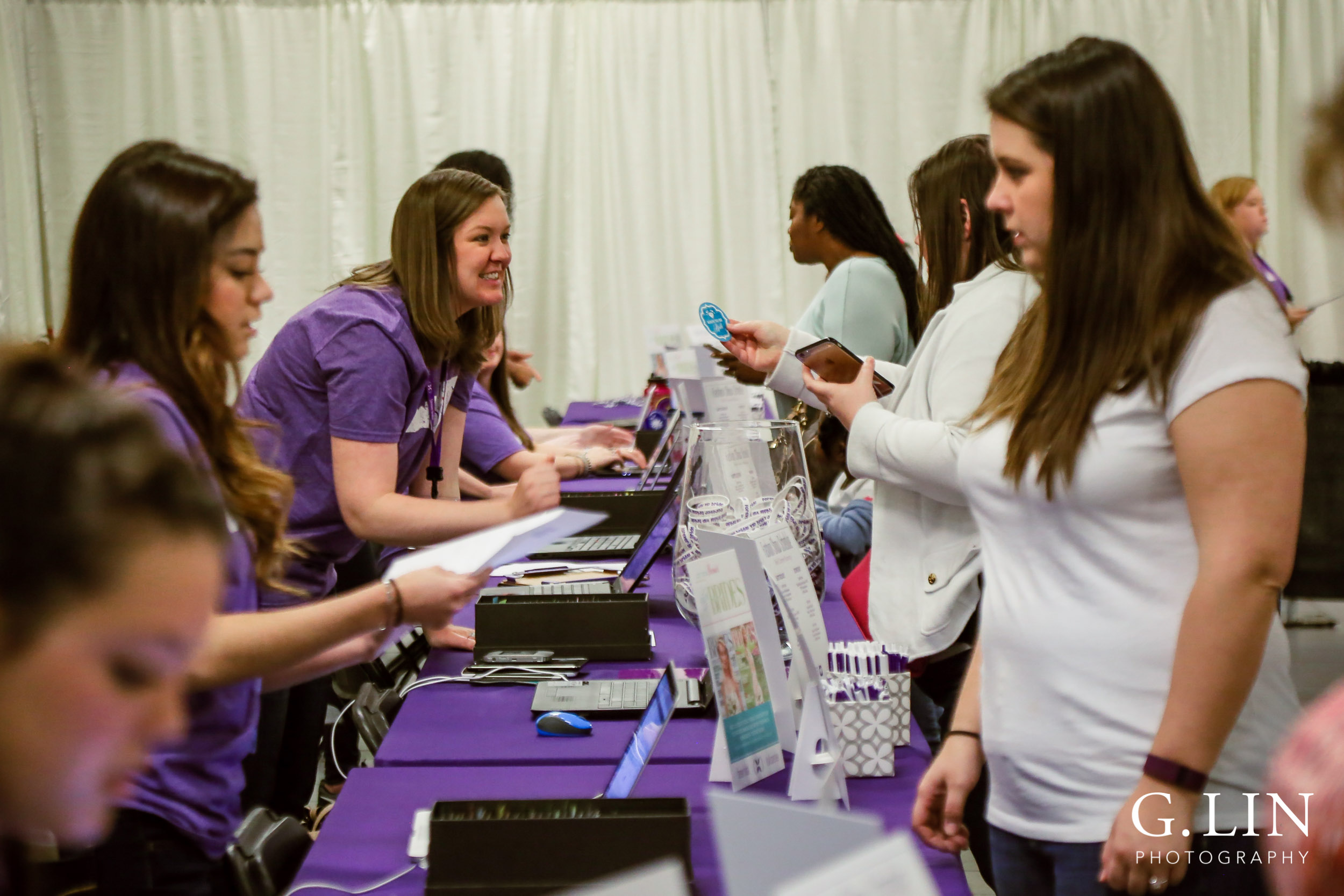 Raleigh Event Photographer | G. Lin Photography | Greeters checking in guests at Jim Graham Building