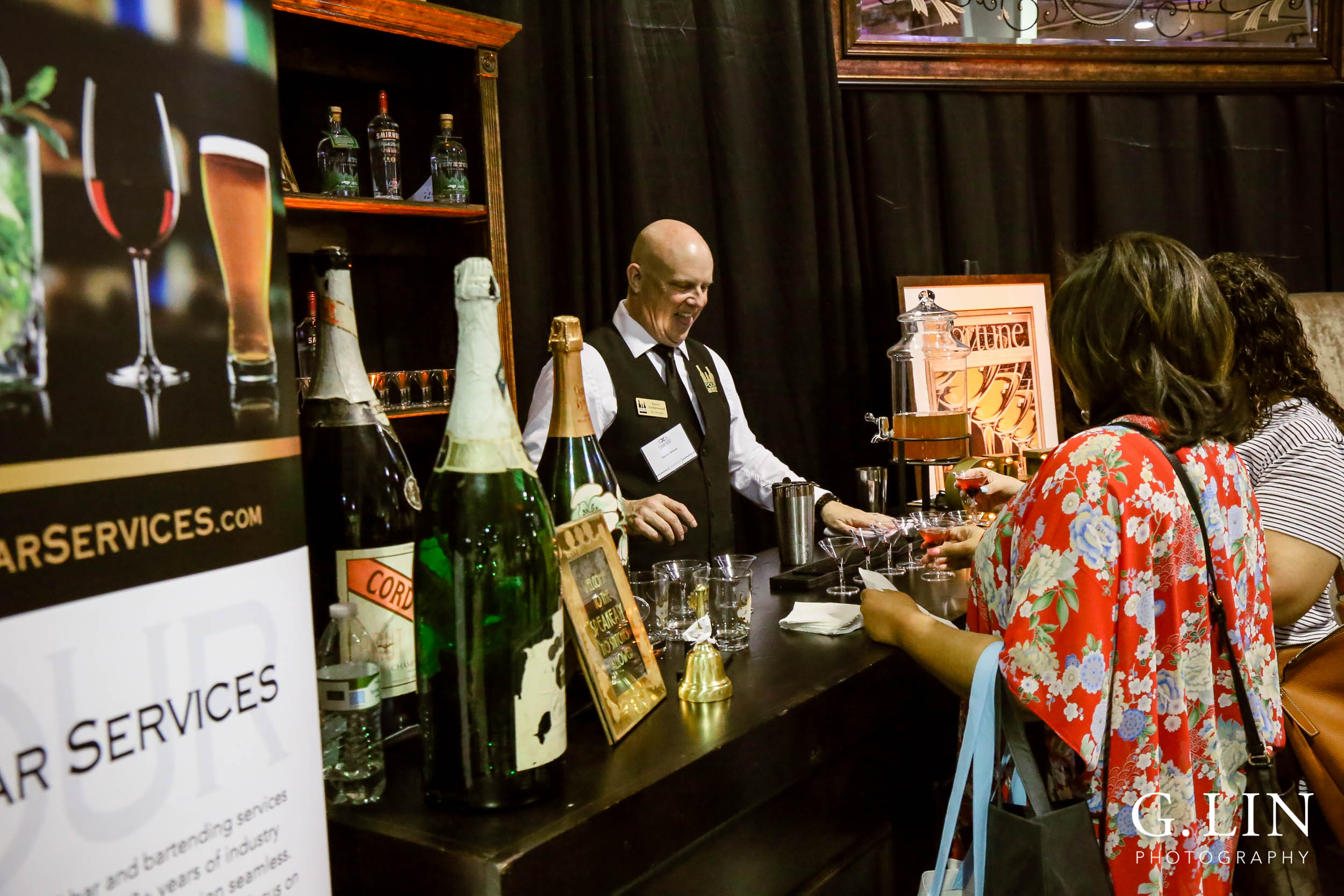 Raleigh Event Photographer | G. Lin Photography | Vendor pouring drinks for guests at wedding show