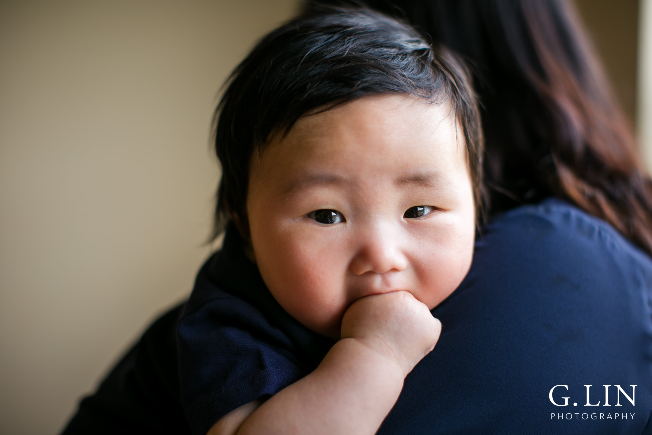 Durham Family Photographer | G. Lin Photography | Baby on mom's shoulder looking at camera