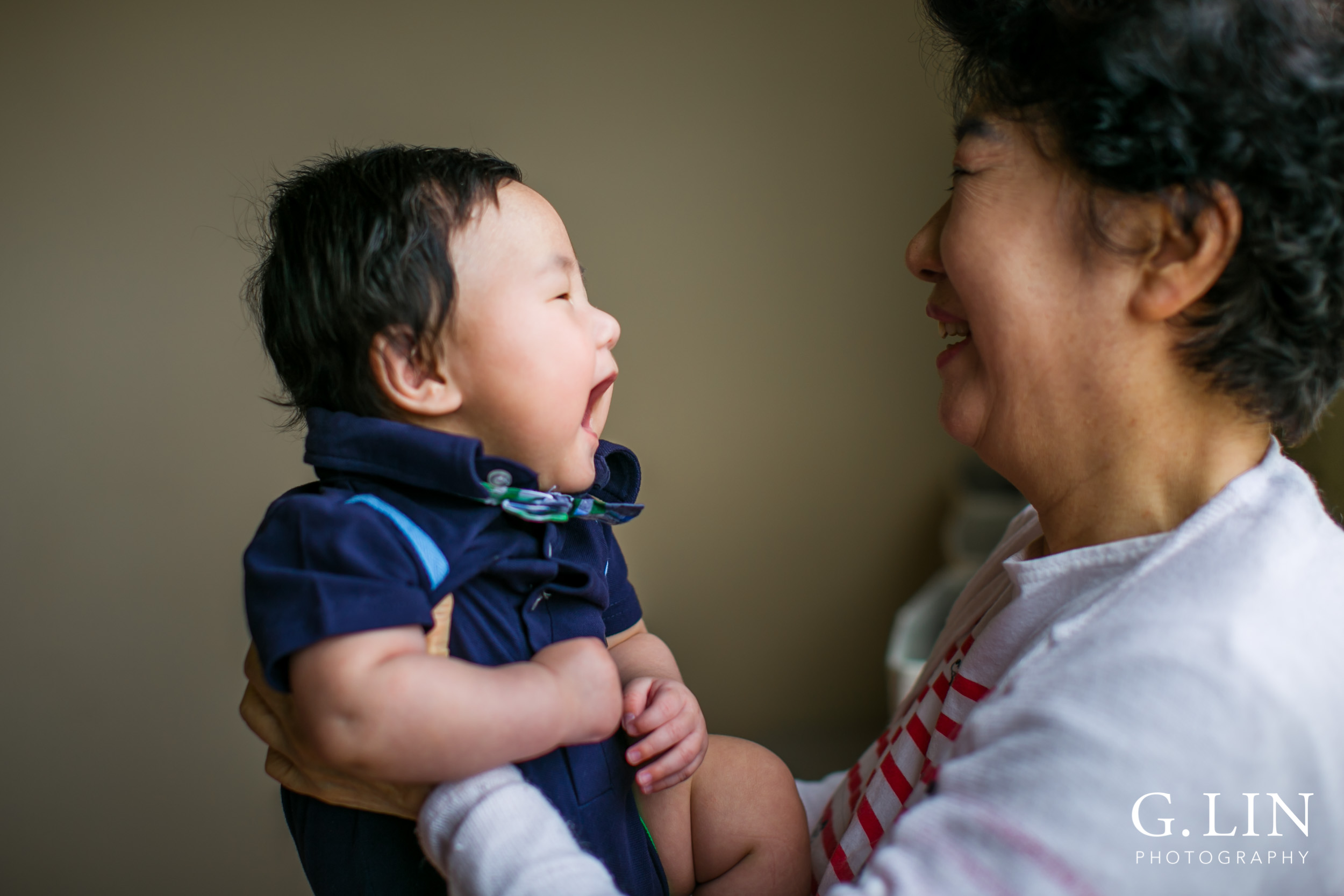Durham Family Photographer | G. Lin Photography | Baby and grandma at home laughing together