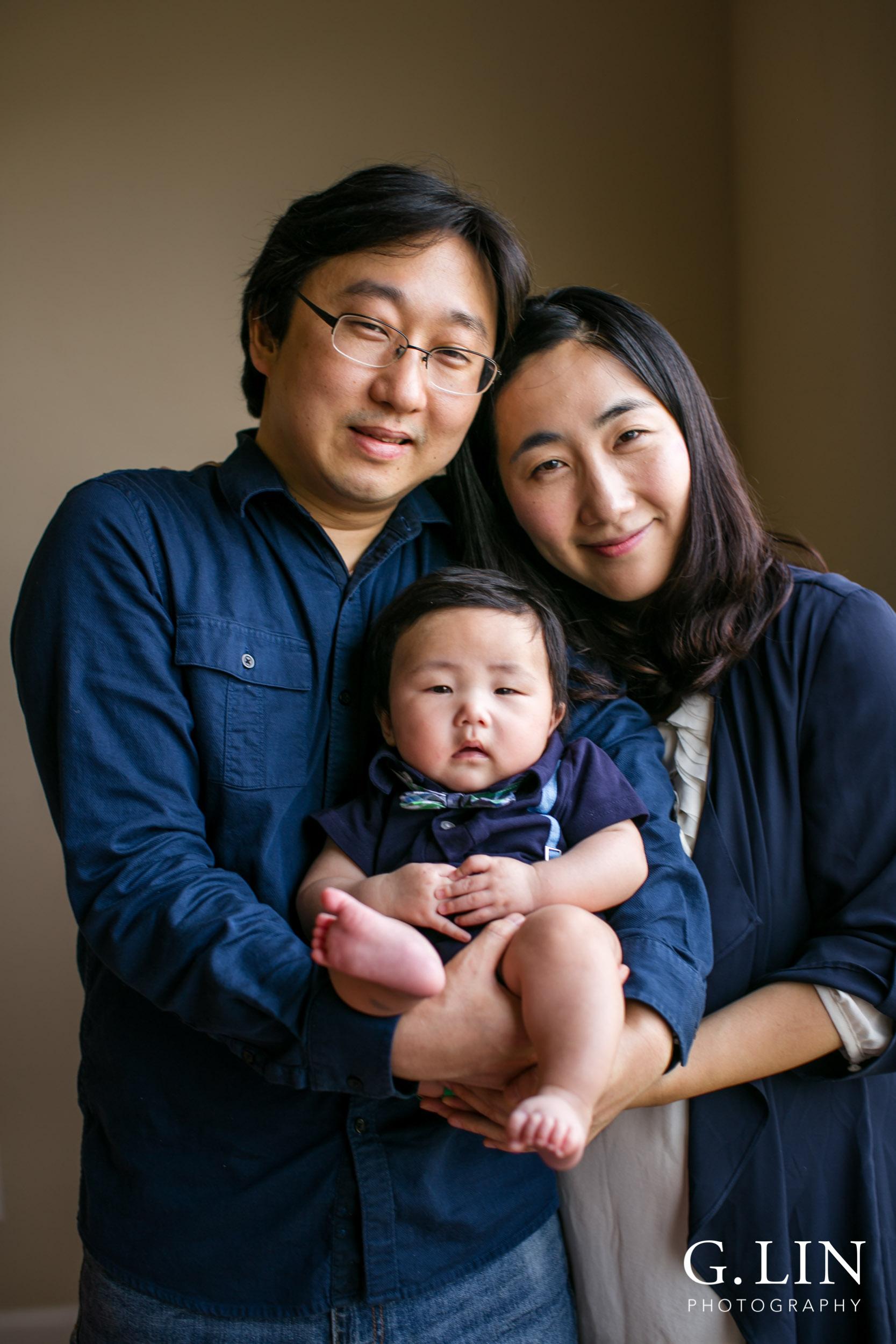 Durham Family Photographer | G. Lin Photography | Family photo at home next with baby next to window