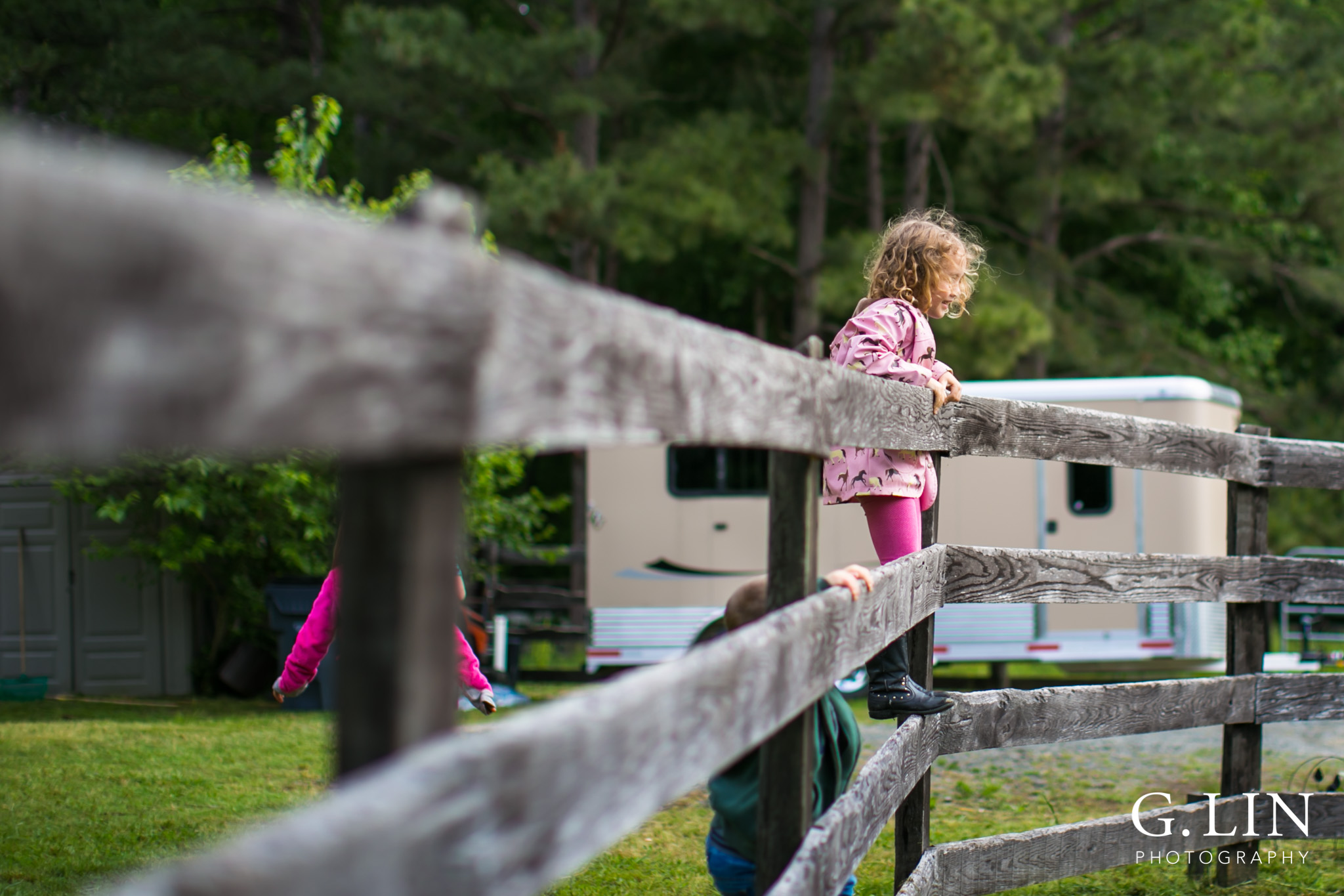 G. Lin Photography | Raleigh Event Photographer | Girl on fence looking around