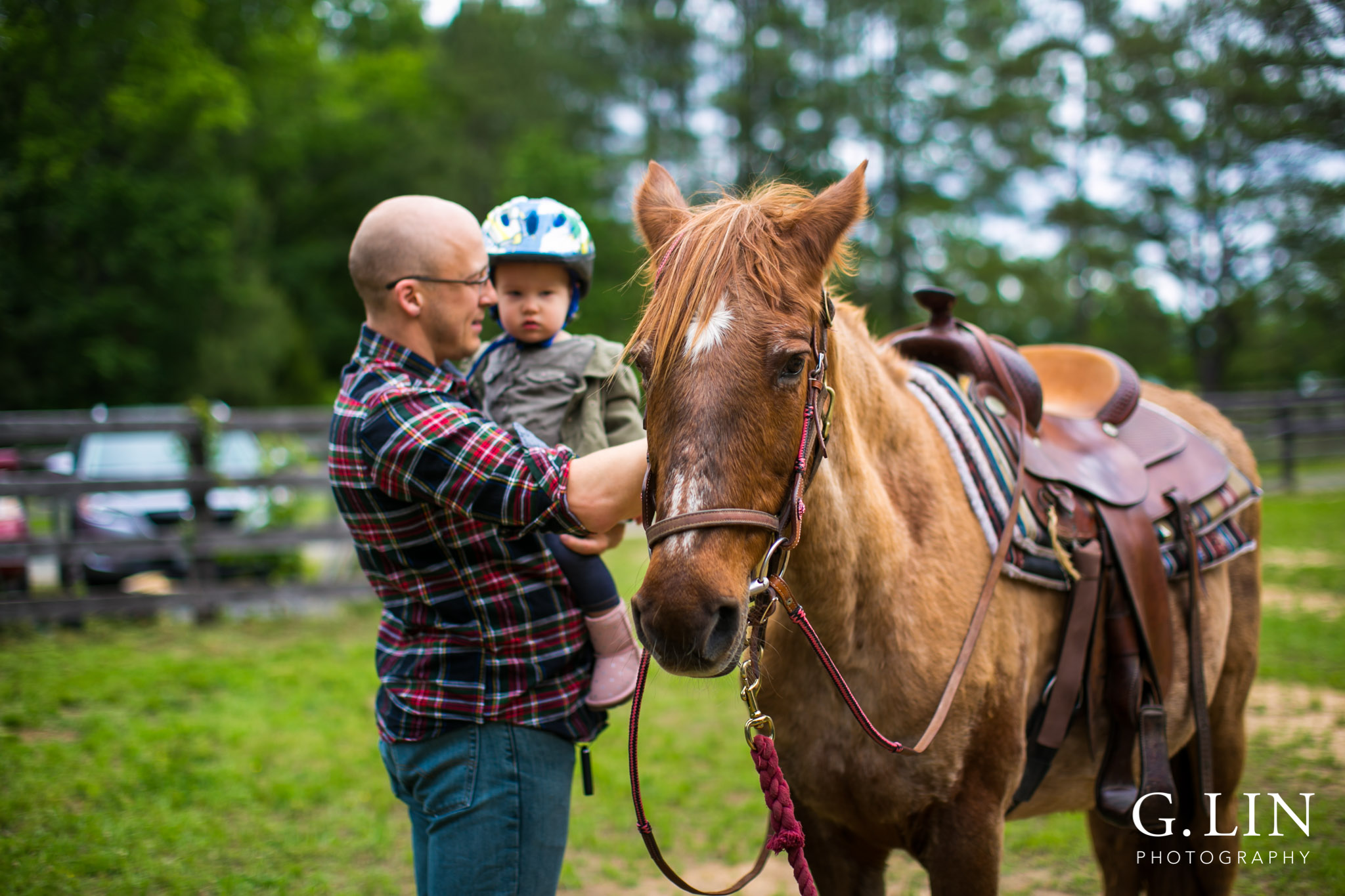 G. Lin Photography | Raleigh Event Photographer | Father and son petting horse on field