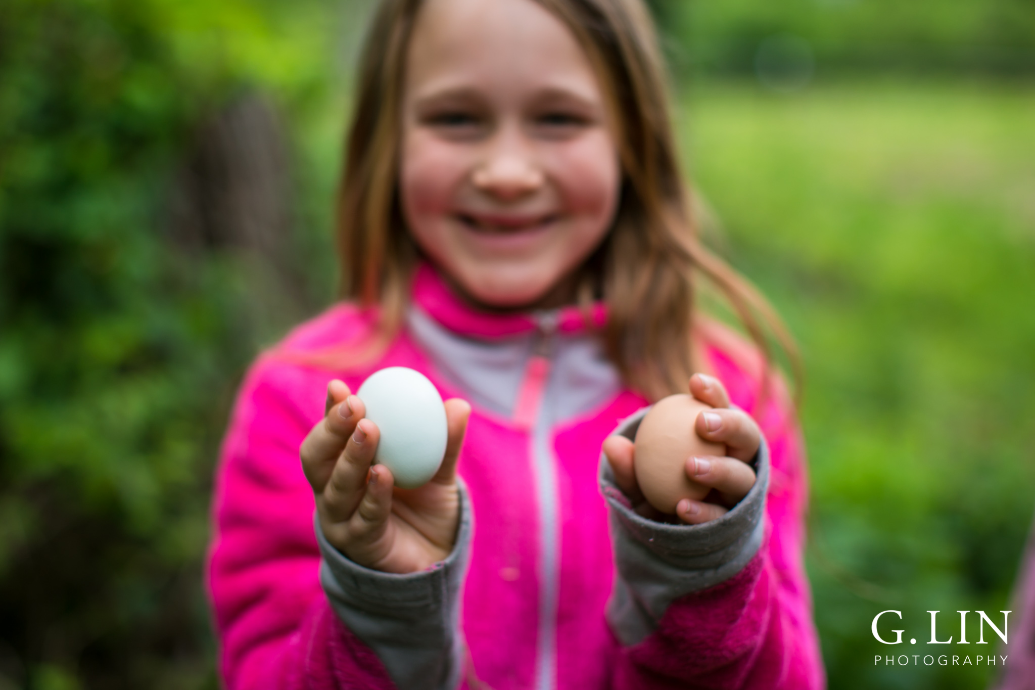 G. Lin Photography | Raleigh Event Photographer | Girl holding two eggs on farm