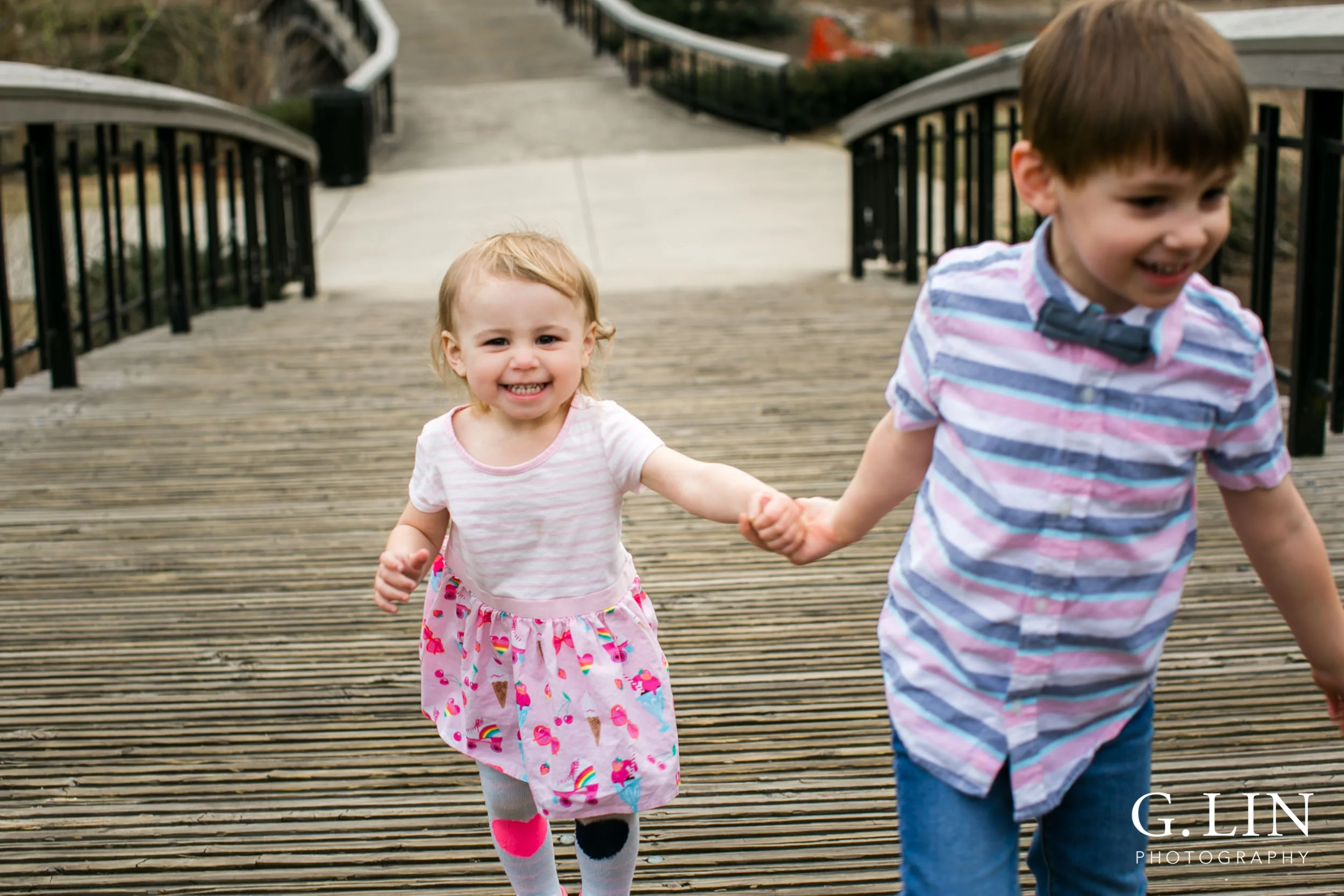 G. Lin Photography | Raleigh Family Photographer | Siblings holding hands and running towards camera