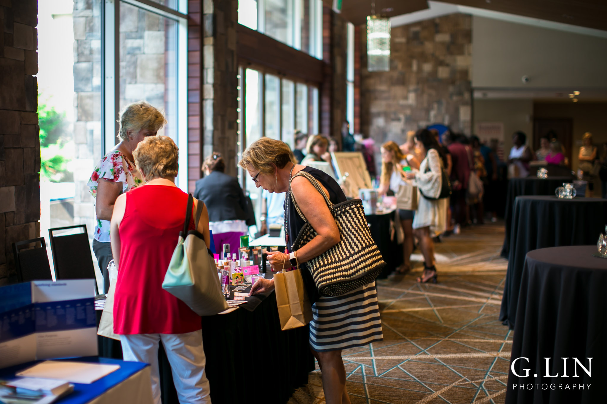 Raleigh Event Photographer | G. Lin Photography | Women shopping at counter