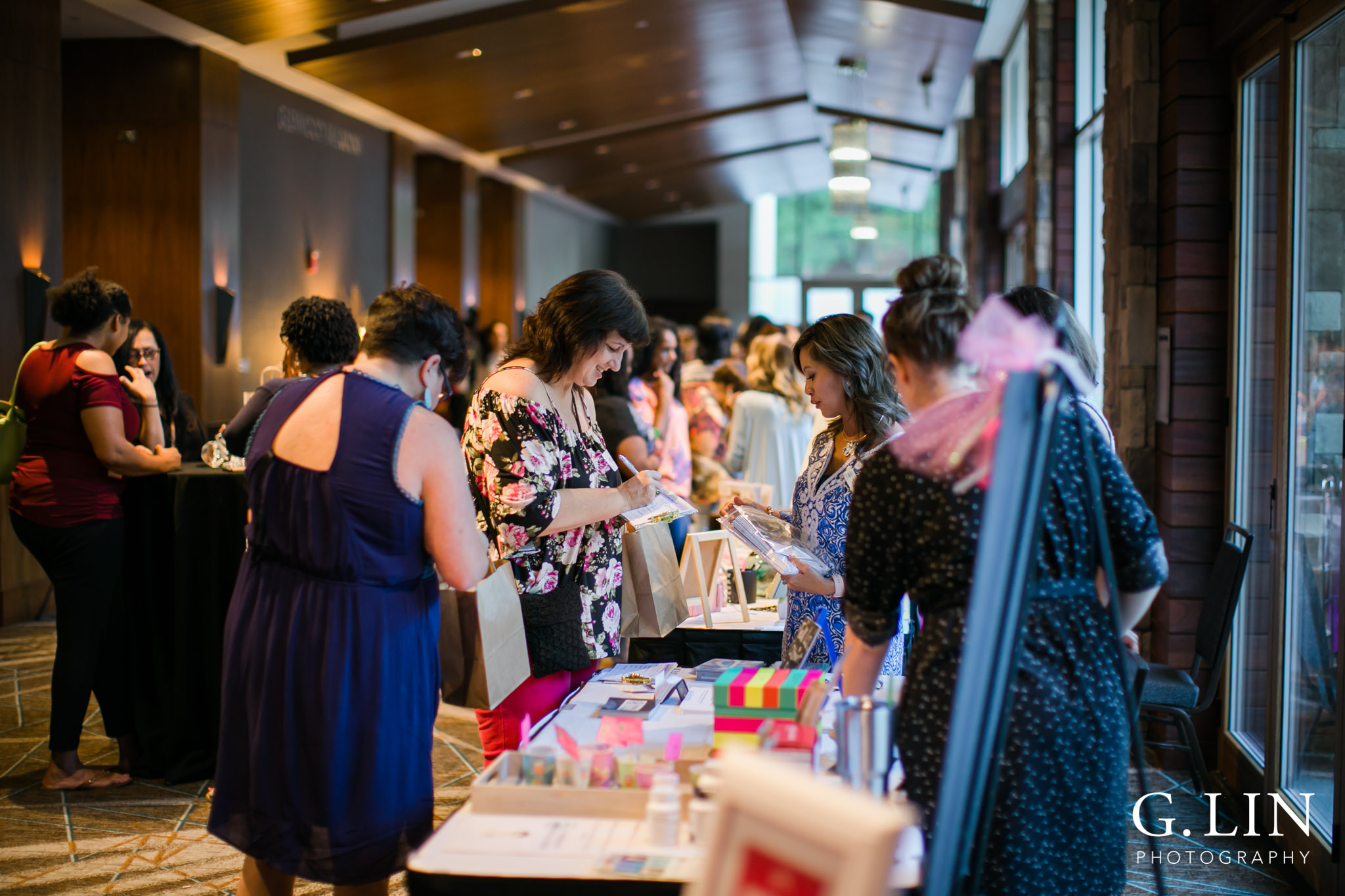 Raleigh Event Photographer | G. Lin Photography | Guests purchasing items at vendor booths