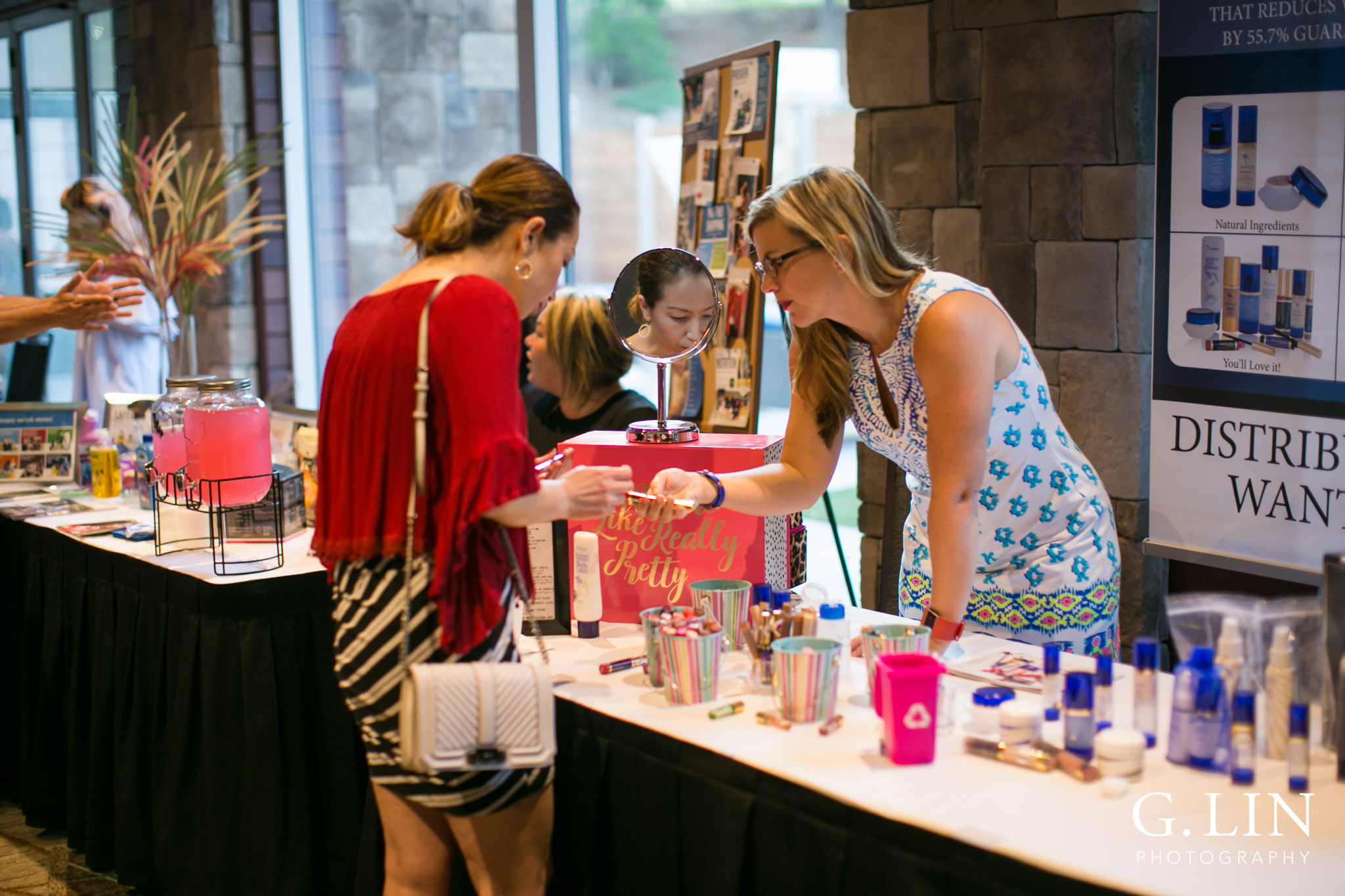 Raleigh Event Photographer | G. Lin Photography | Woman giving advice to customer at table