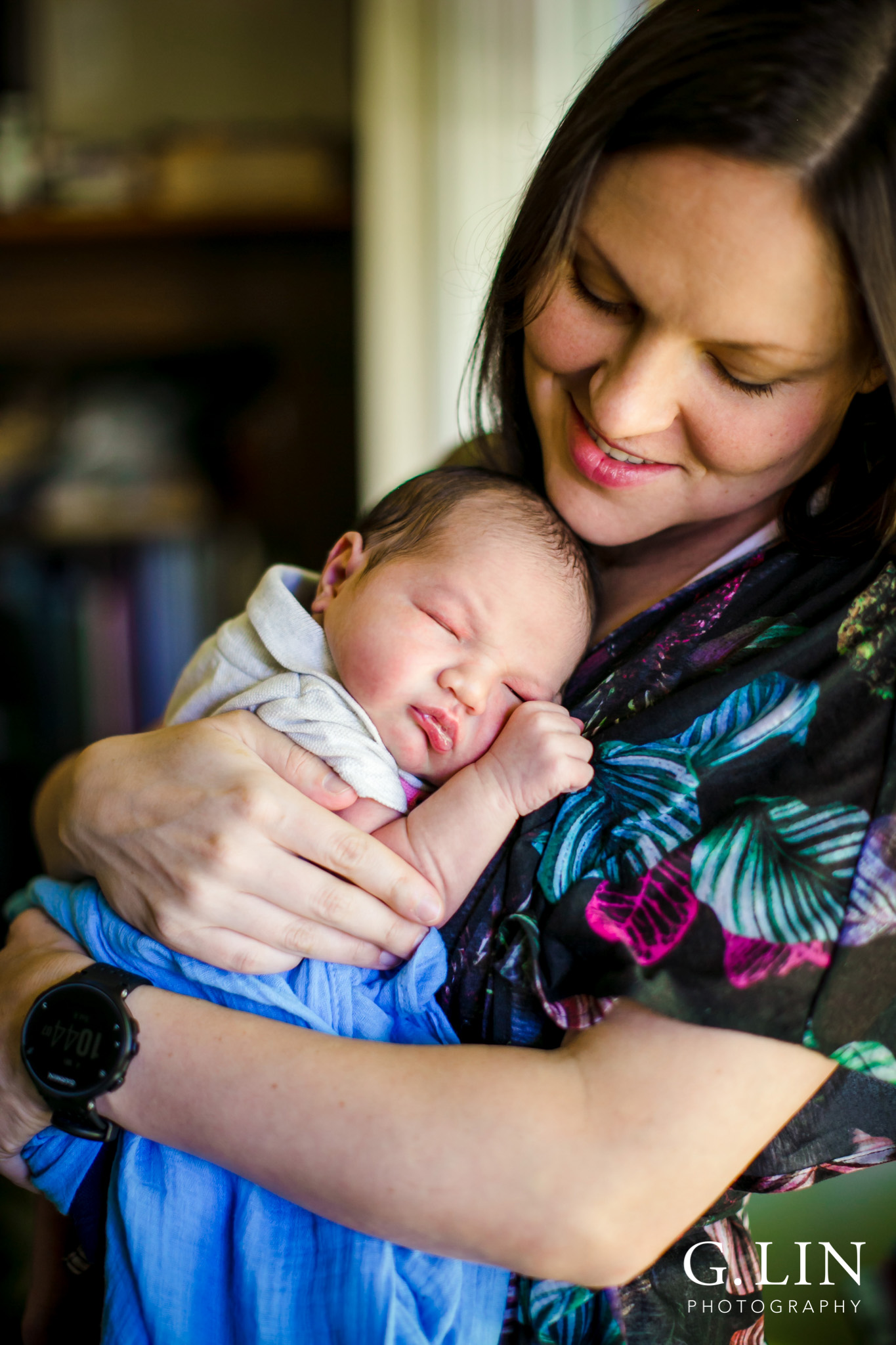 Raleigh Family Photographer | G. Lin Photography | Mother holding baby next to window