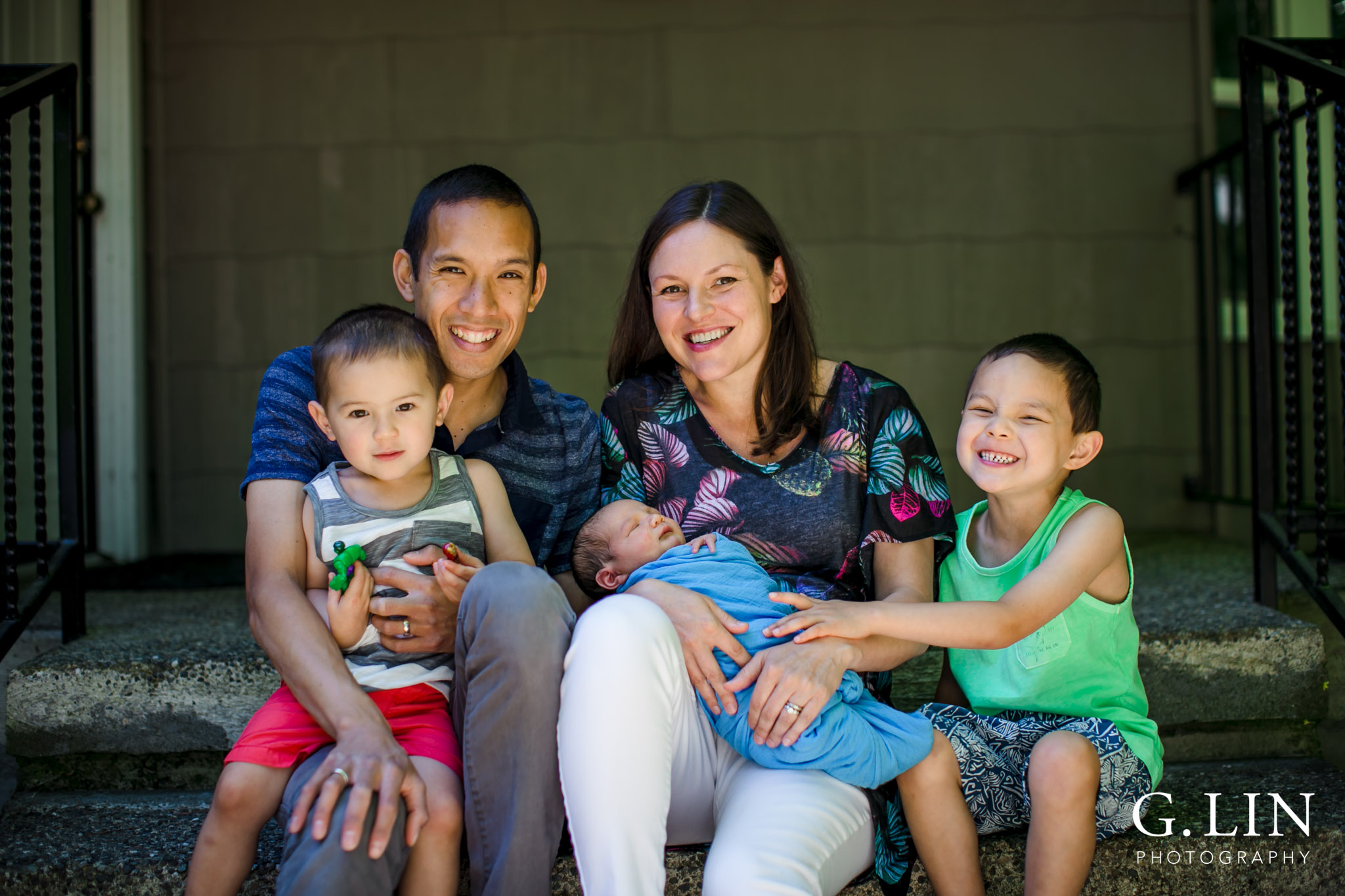 Raleigh Family Photographer | G. Lin Photography | Family outside of home and smiling
