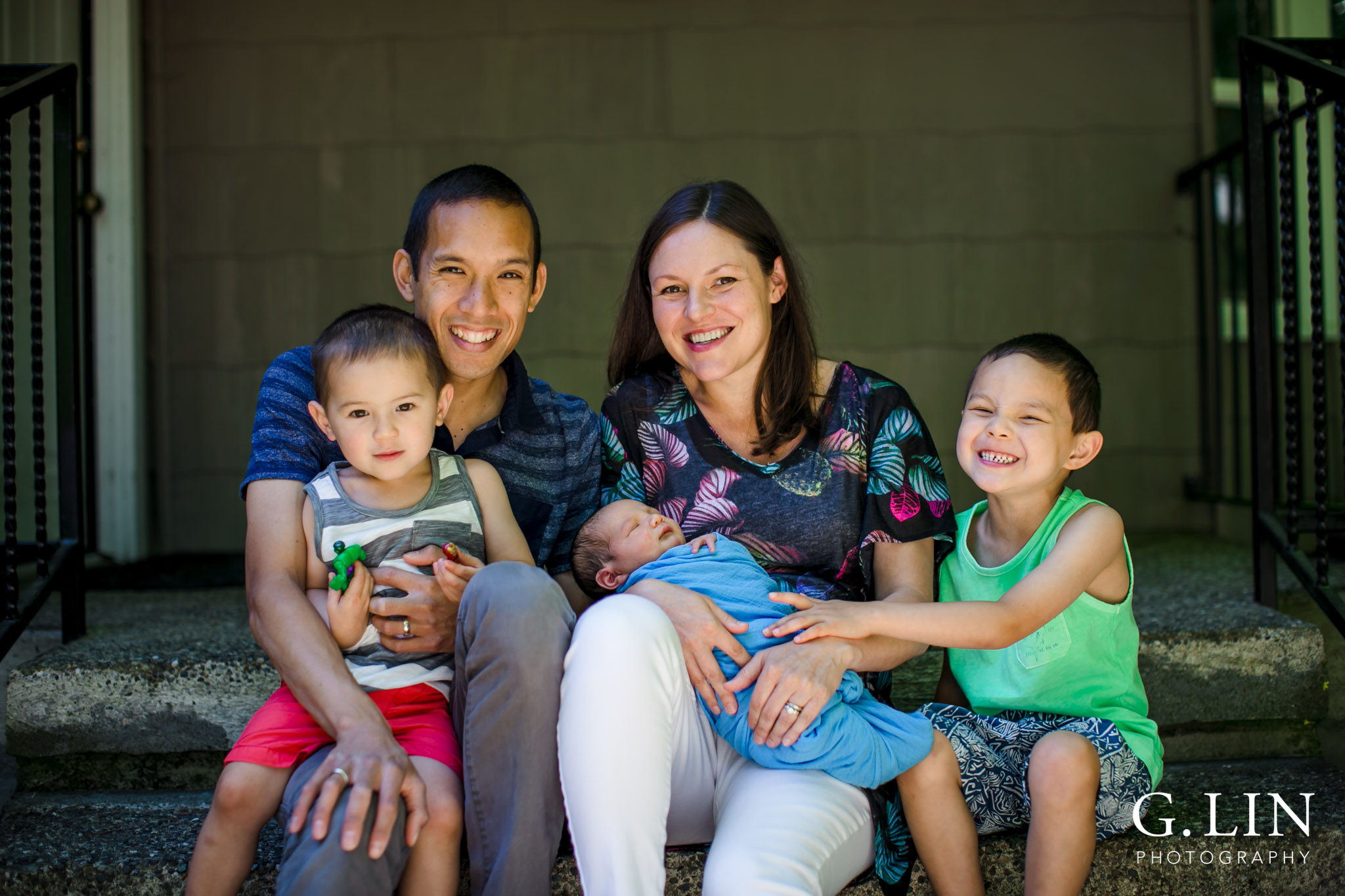 Raleigh Family Photographer | G. Lin Photography | Family outside of home and smiling