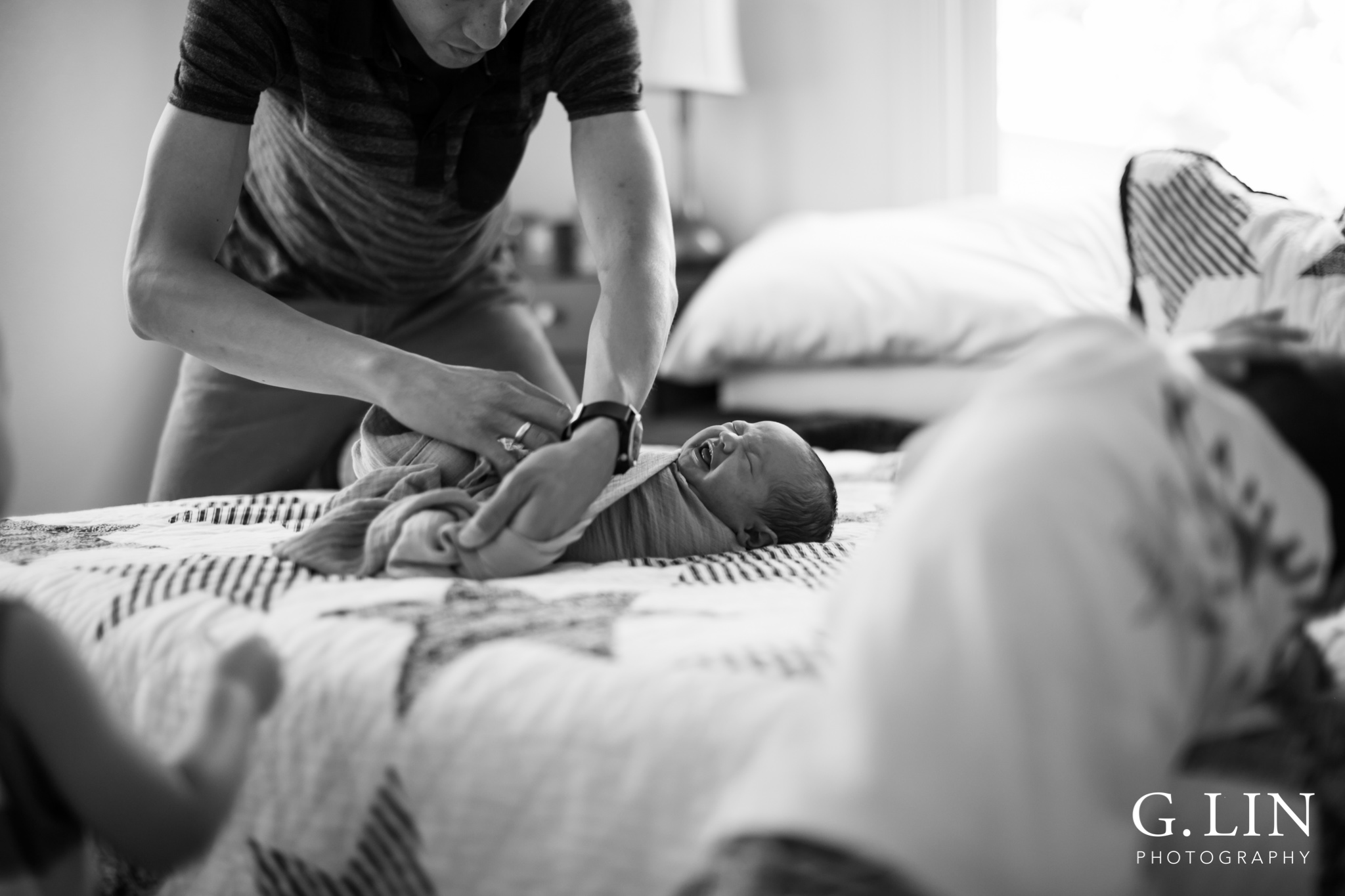 Raleigh Family Photographer | G. Lin Photography | Dad changing baby's diaper