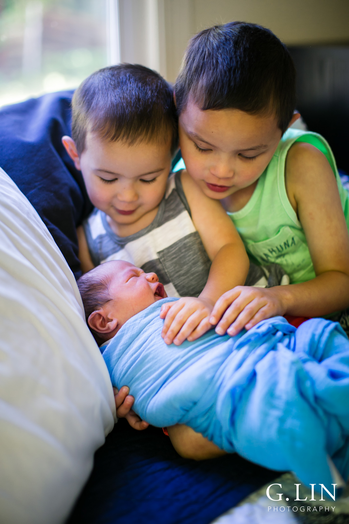 Raleigh Family Photographer | G. Lin Photography | Brothers holding baby brother