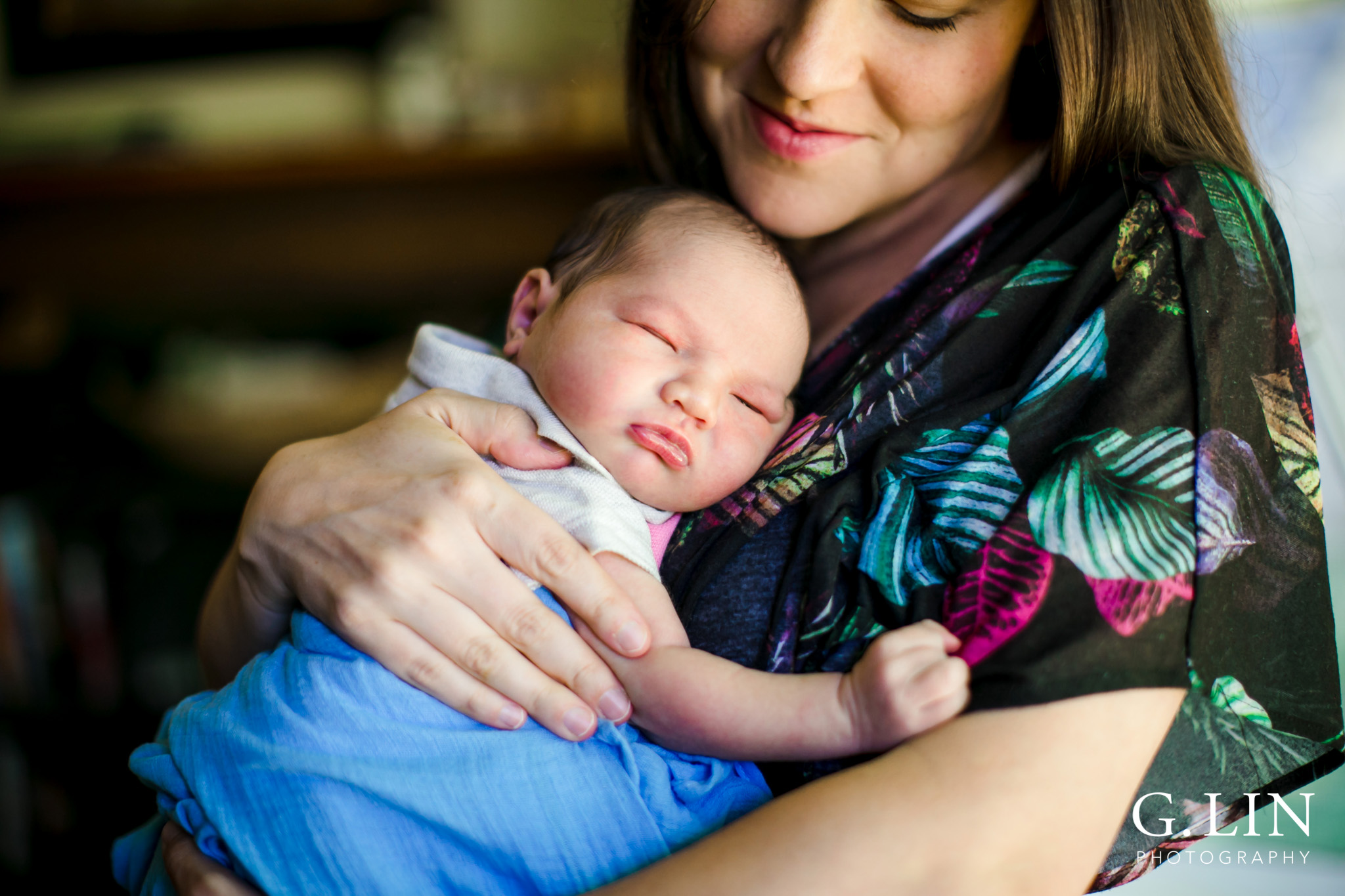 Raleigh Family Photographer | G. Lin Photography | Mother holding baby next to window