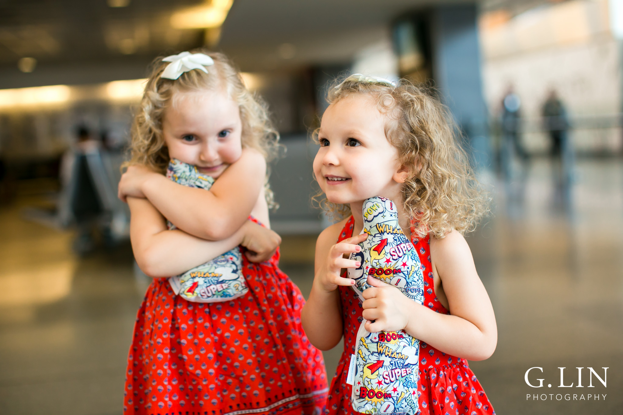 Raleigh Family Photographer | G. Lin Photography | girls holding their dad dolls