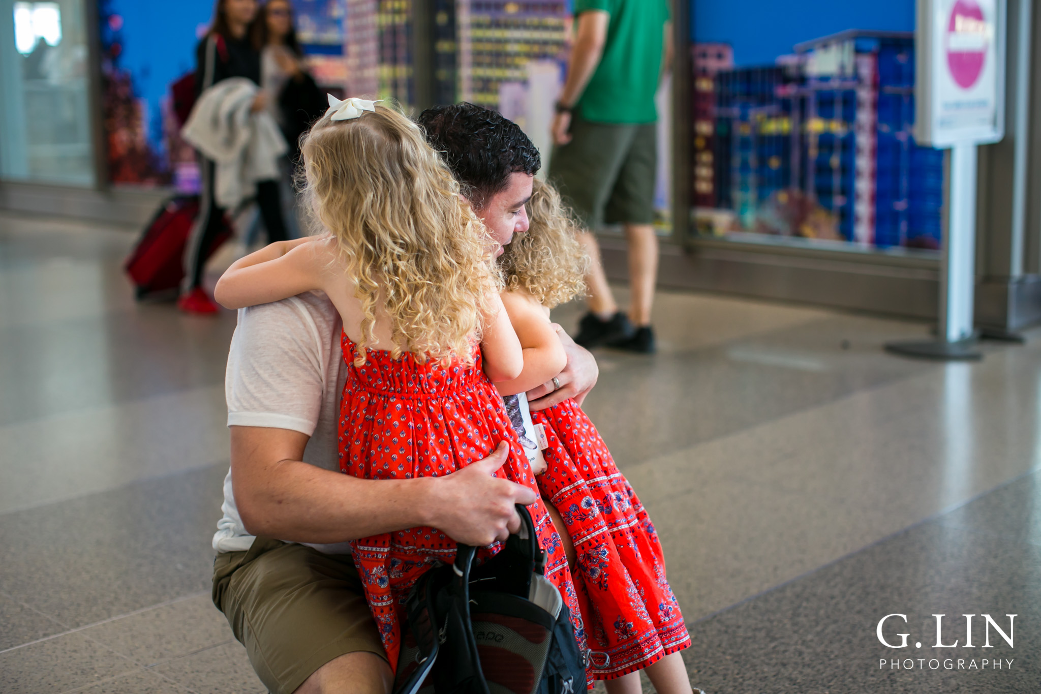 Raleigh Family Photographer | G. Lin Photography | dad hugging his daughters