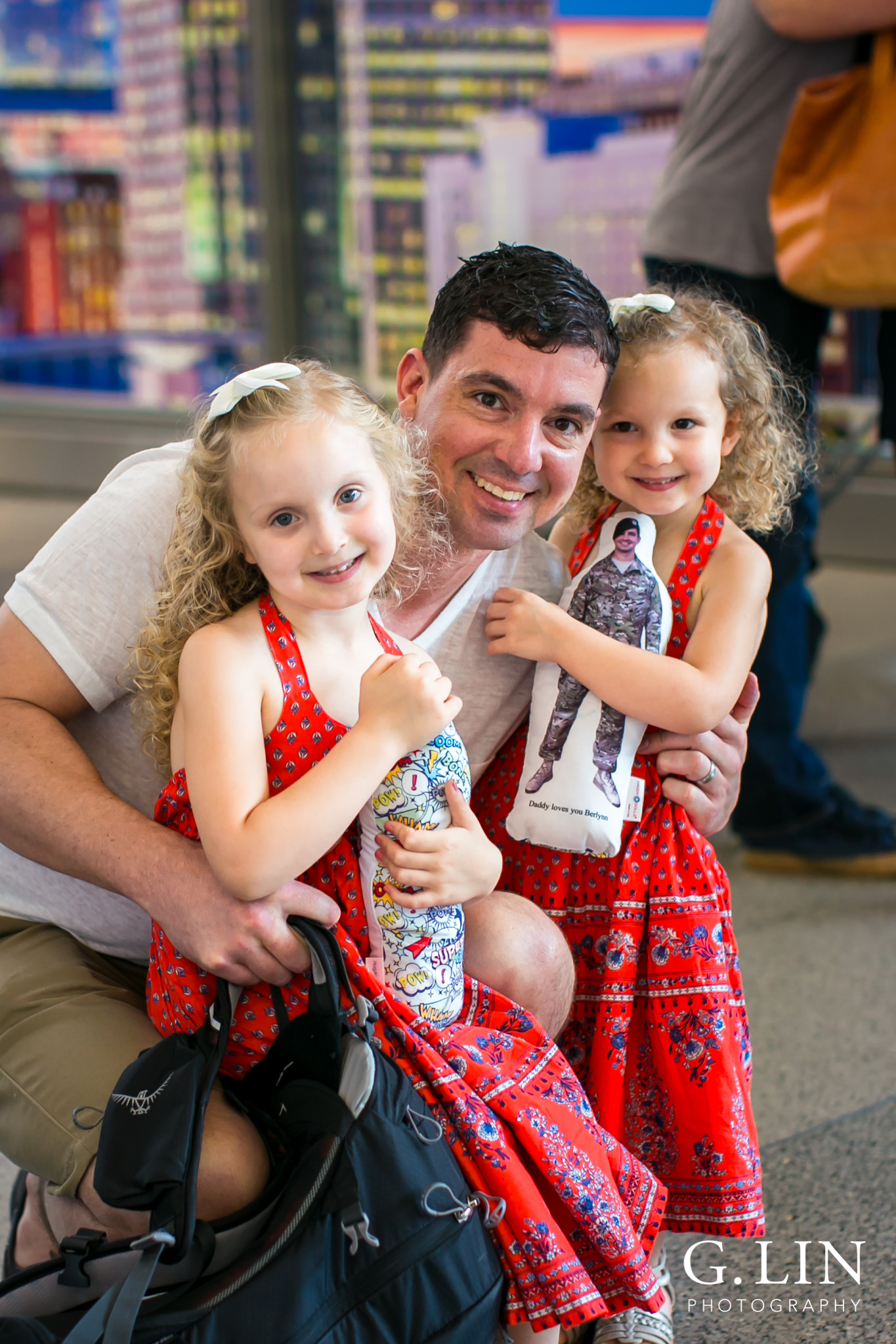 Raleigh Family Photographer | G. Lin Photography | close up of dad with his two daughter smiling at camera