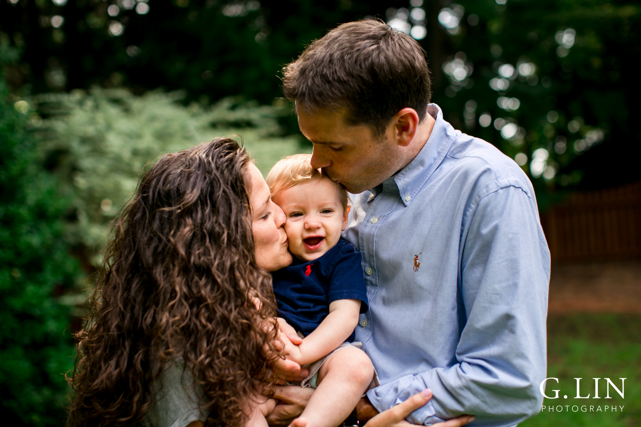 Raleigh Family Photographer | G. Lin Photography | Mom and Dad kissing baby on cheeks