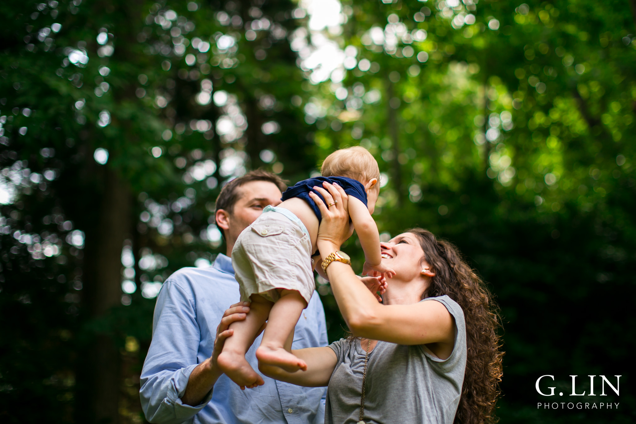 Raleigh Family Photography | G. Lin Photography | Mom and dad throwing baby in the air