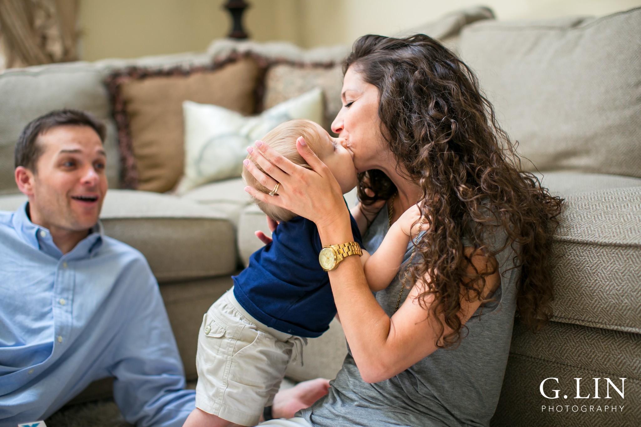 Raleigh Family Photographer | G. Lin Photography | Baby kissing mommy on the cheek in the living room