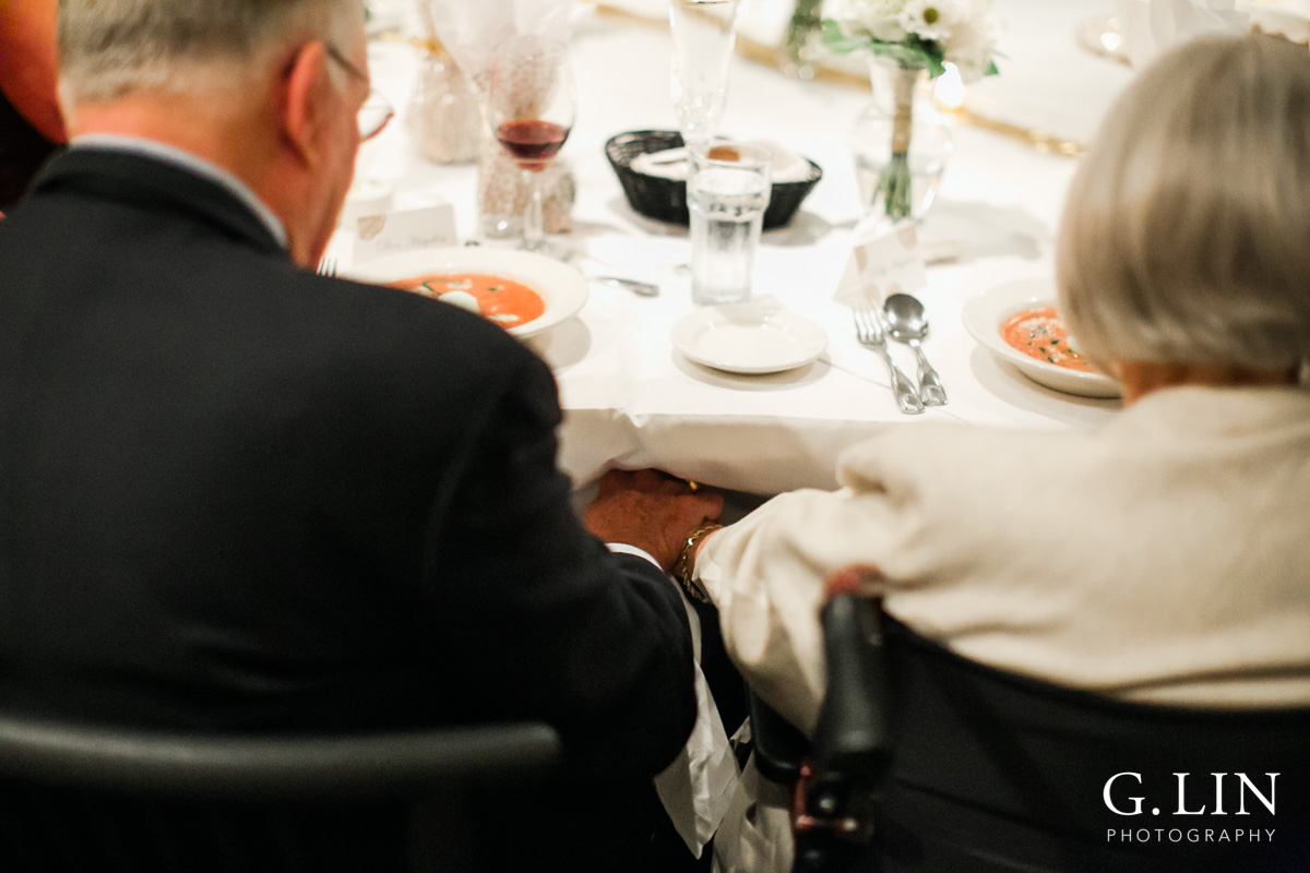 Raleigh Event Photographer | G. Lin Photography | Old couple holding hands during prayer