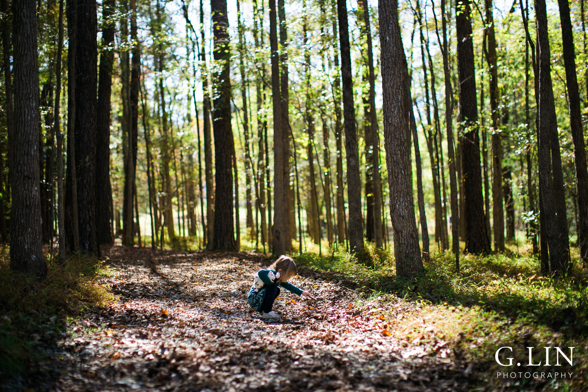 Durham Family Photographer | G. Lin Photography | Little girl exploring in the forest