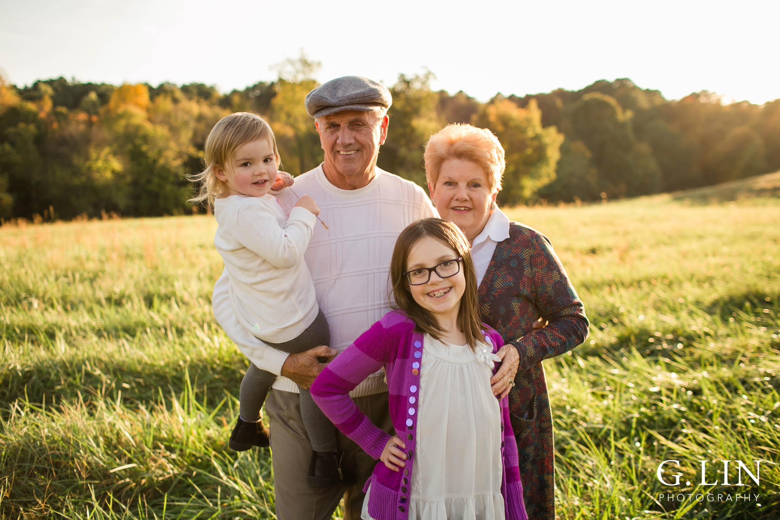 Gorgeous photo of grandkids with grandparents in open field | Raleigh Family Photographer | G. Lin Photography