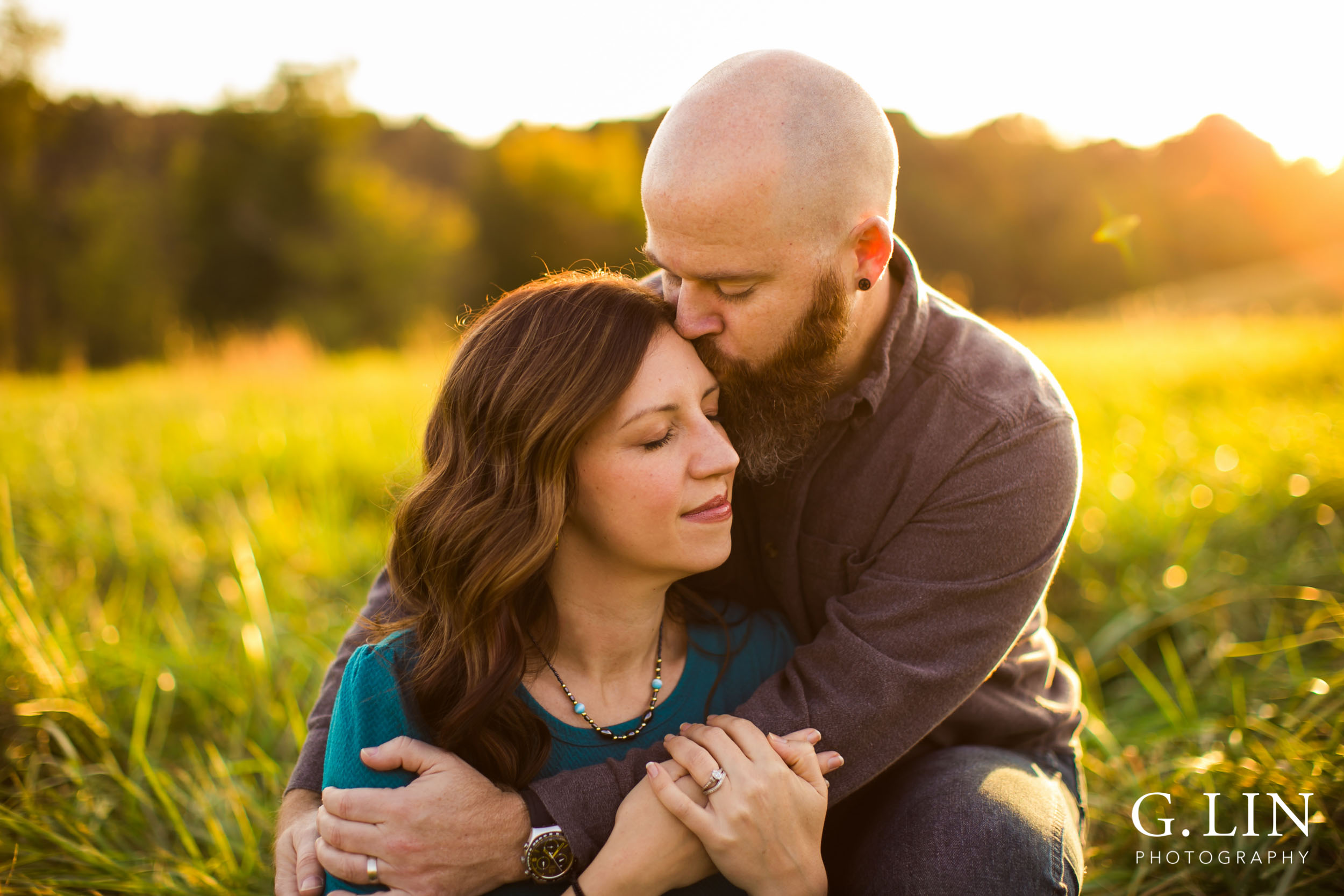 Intimate embrace of couple in open field at NC Museum of Art | Raleigh Family Photographer | G. Lin Photography