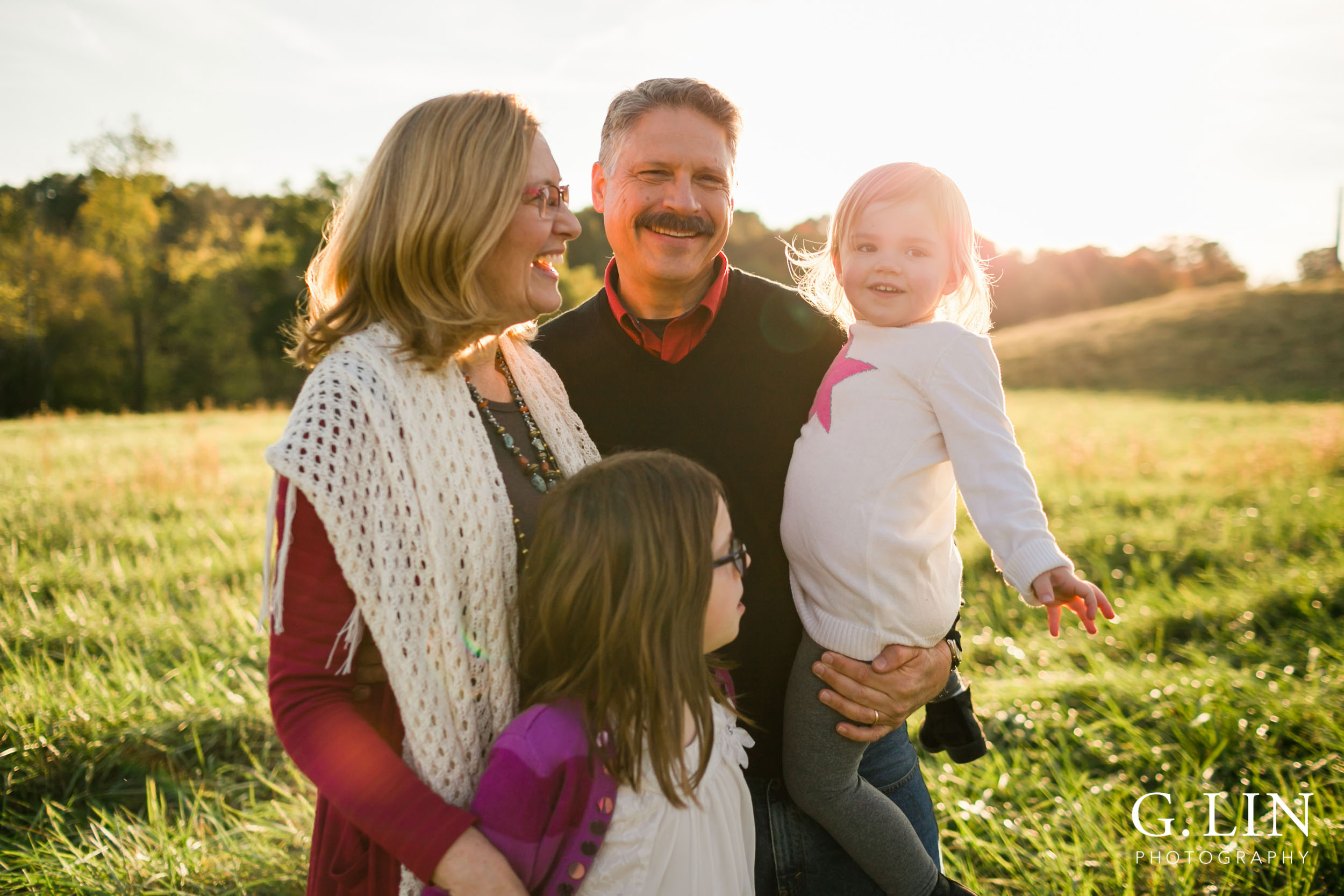 Candid photo of grandparents laughing with grandkids | Raleigh Family Photographer | G. Lin Photography