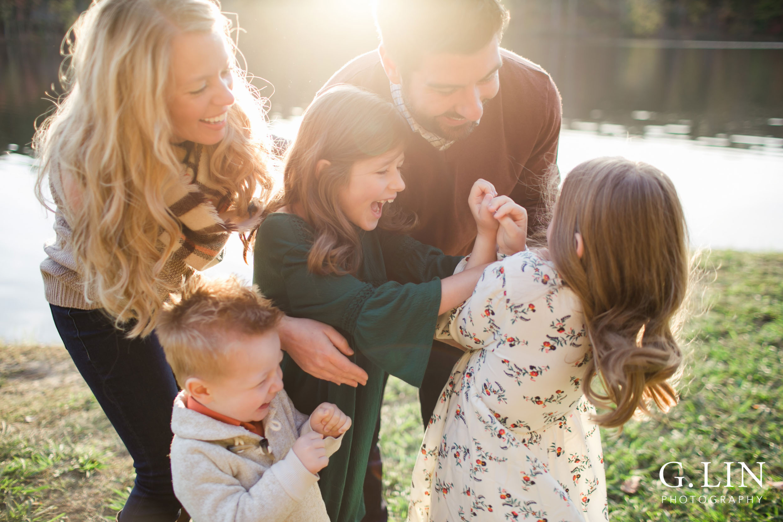 Raleigh Family Photographer | G. Lin Photography | Family tickling each other