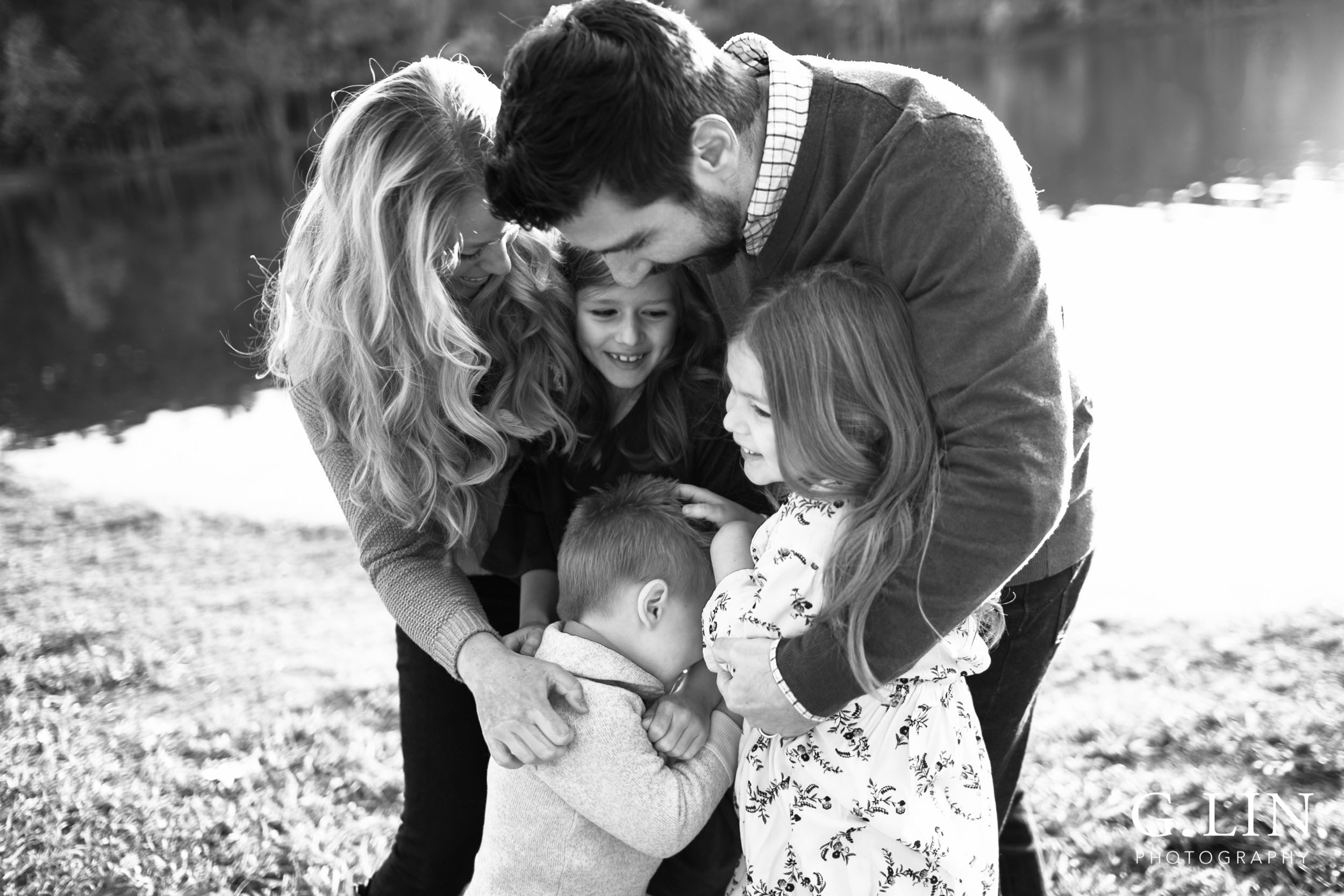 Raleigh Family Photographer | G. Lin Photography | black and white photo of family hugging