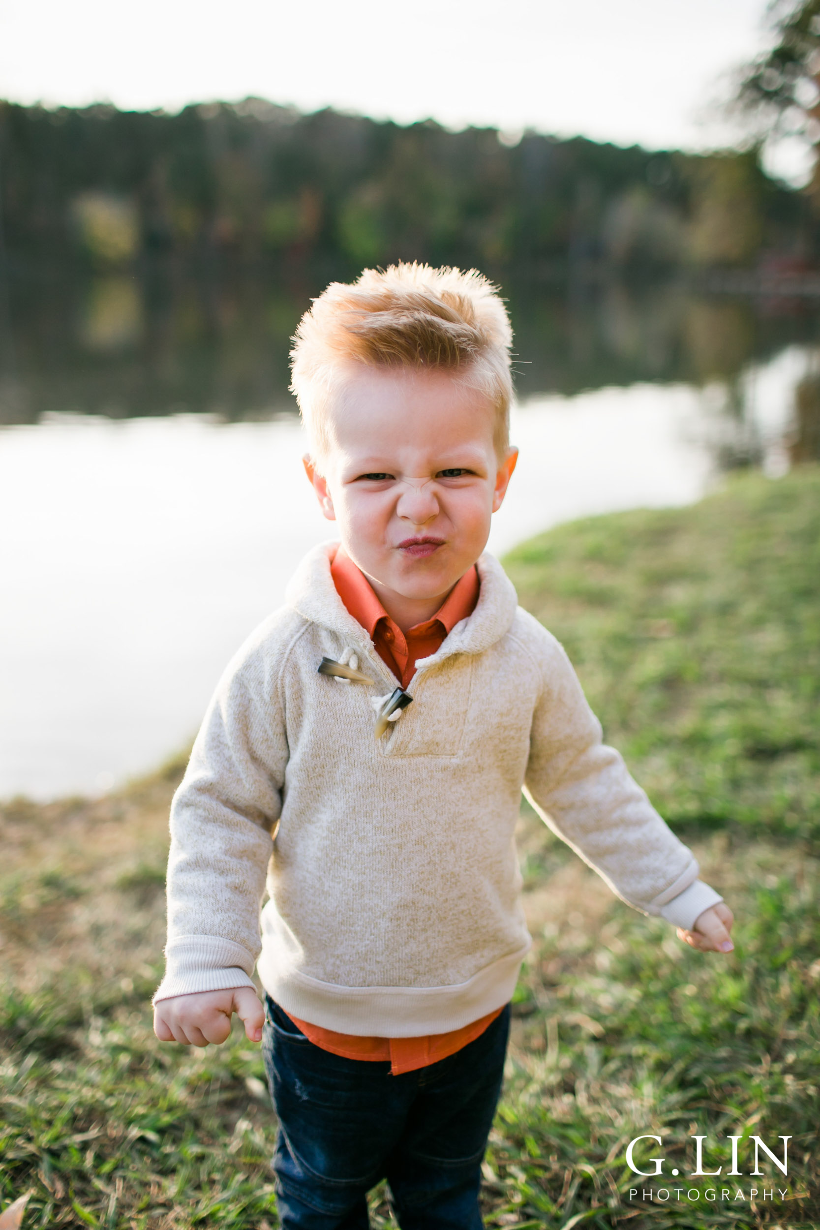 Raleigh Family Photographer | G. Lin Photography | portrait of youngest sibling making a funny face