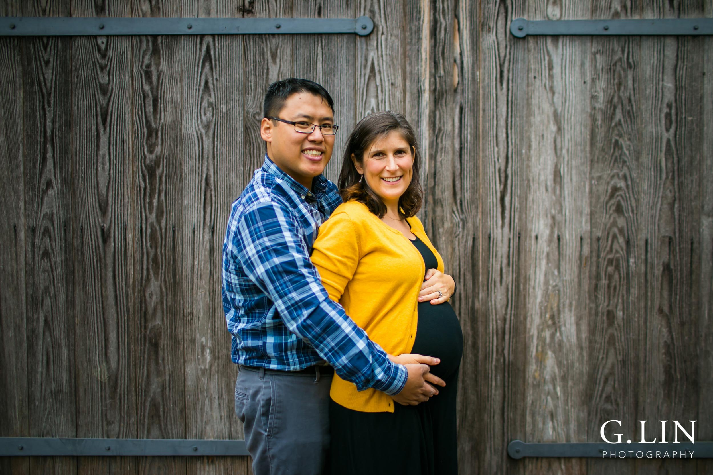 Durham Family Photography | G. Lin Photography | Maternity photo of couple next to wall