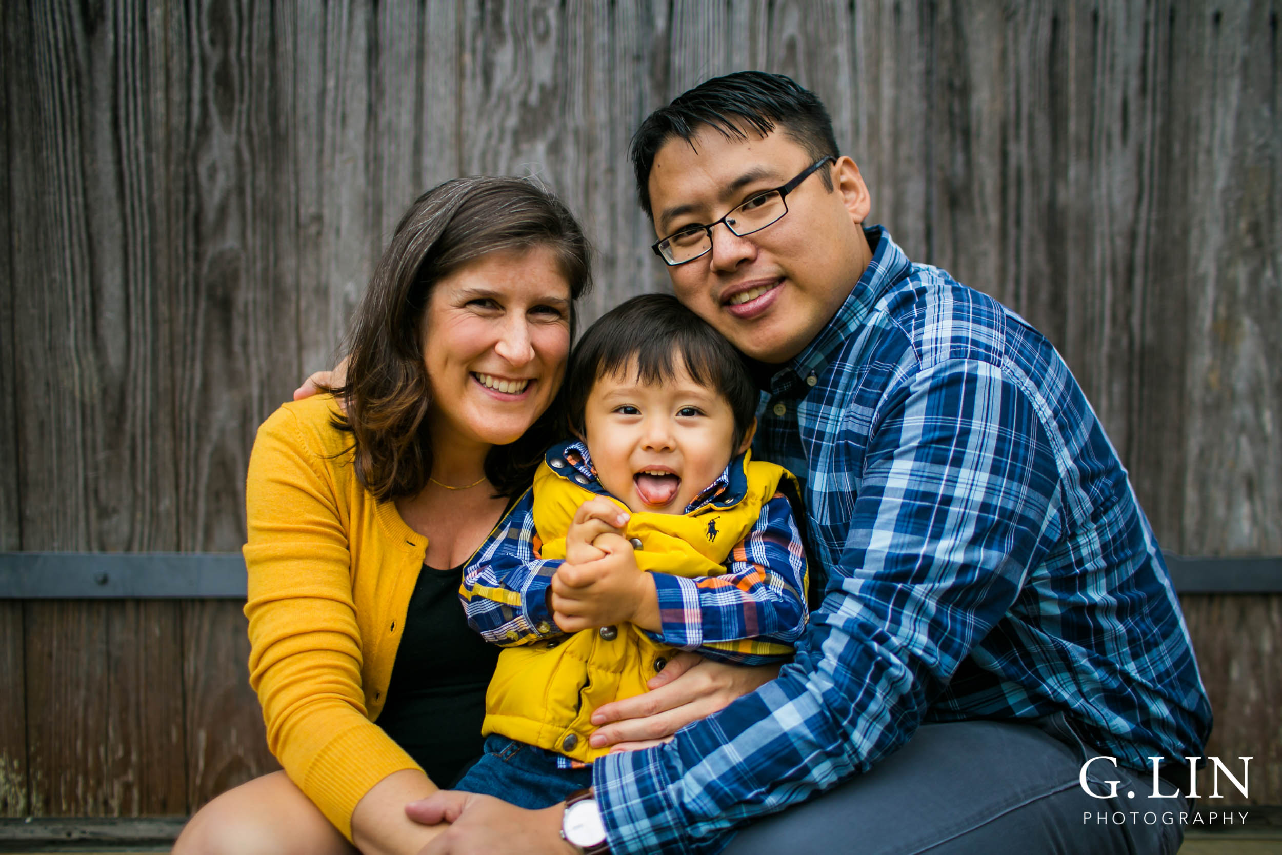 Durham Family Photography | G. Lin Photography | Family of three taking a candid photo