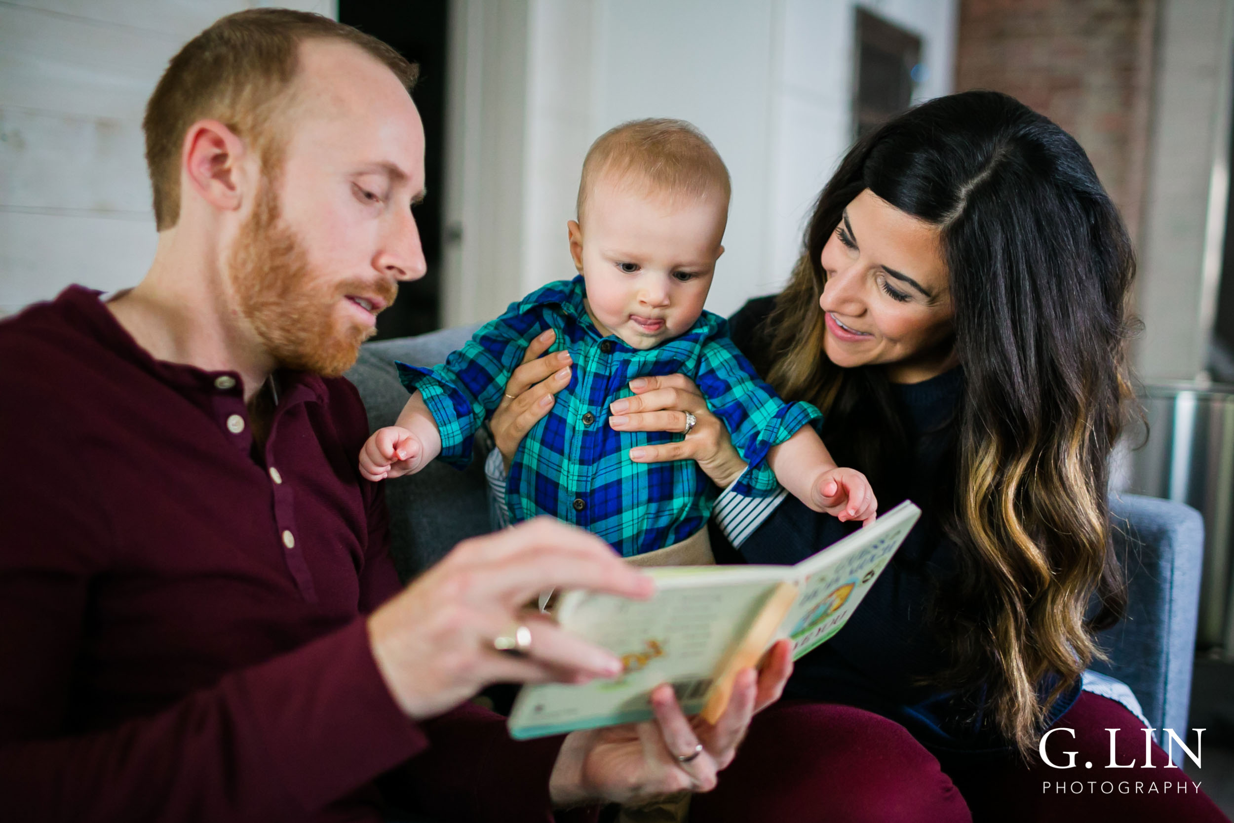 Durham Family Photographer | G. Lin Photography | parents reading book to baby in living room