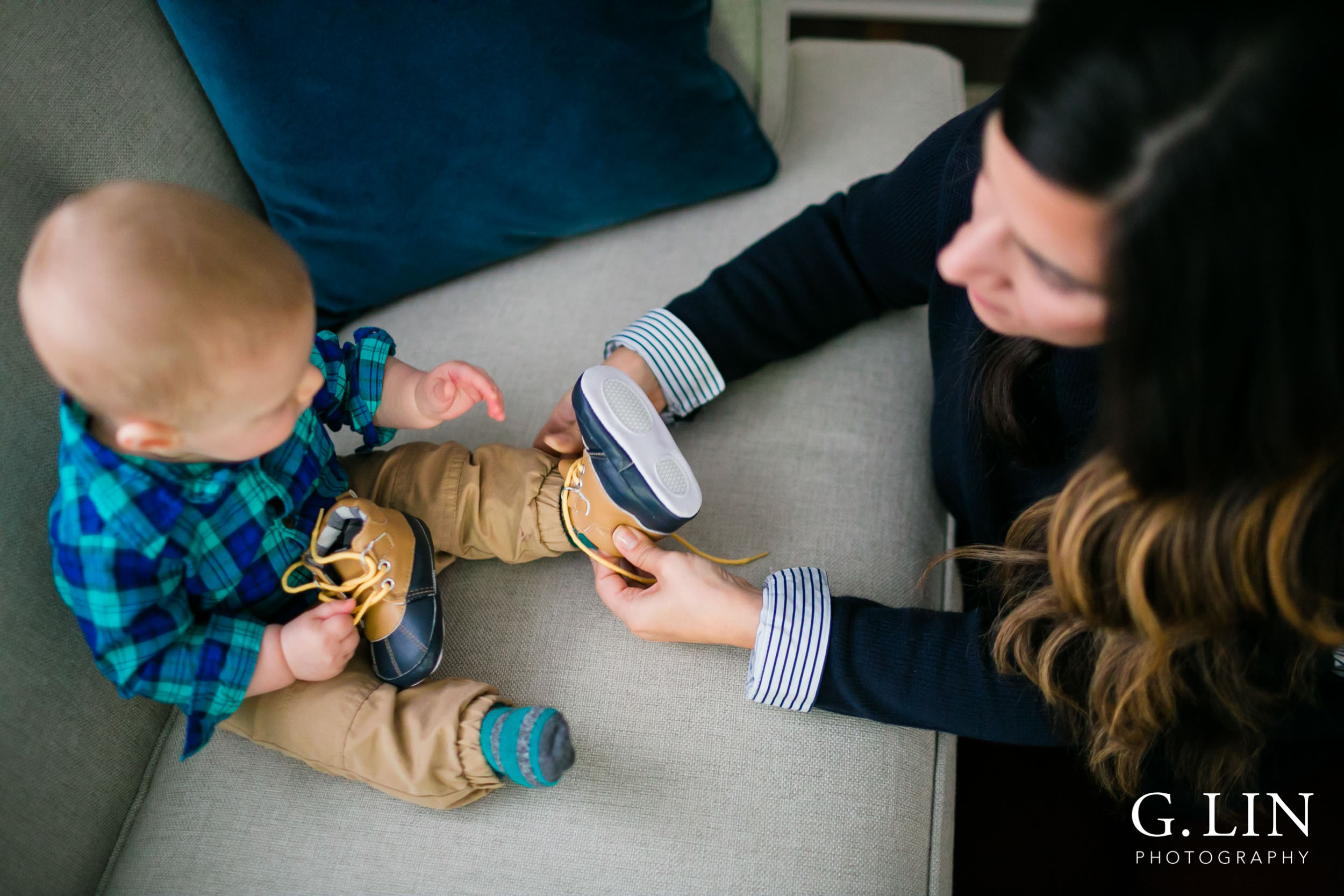 Durham Family Photographer | G. Lin Photography | birds eye view of mom putting shoes on baby