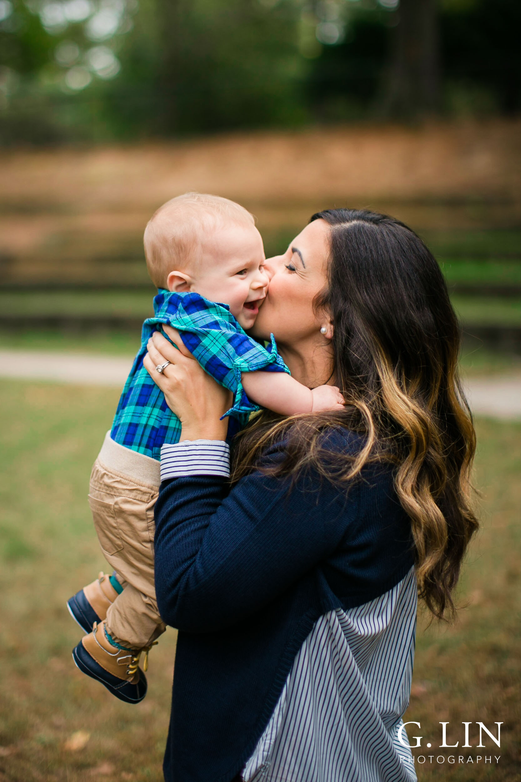 Raleigh Newborn Photographer | G. Lin Photography | Mom kissing baby boy at park