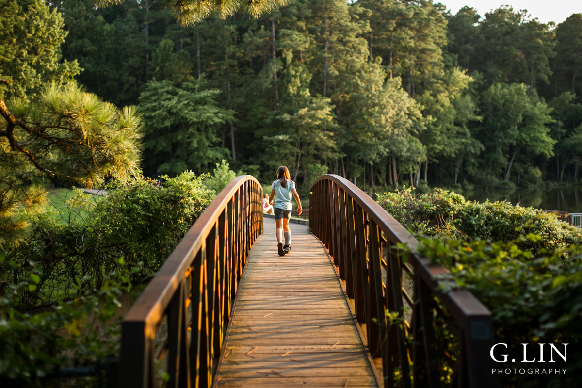 Raleigh Family Photographer | By G. Lin Photography | Girl walking on bridge at Umstead Park