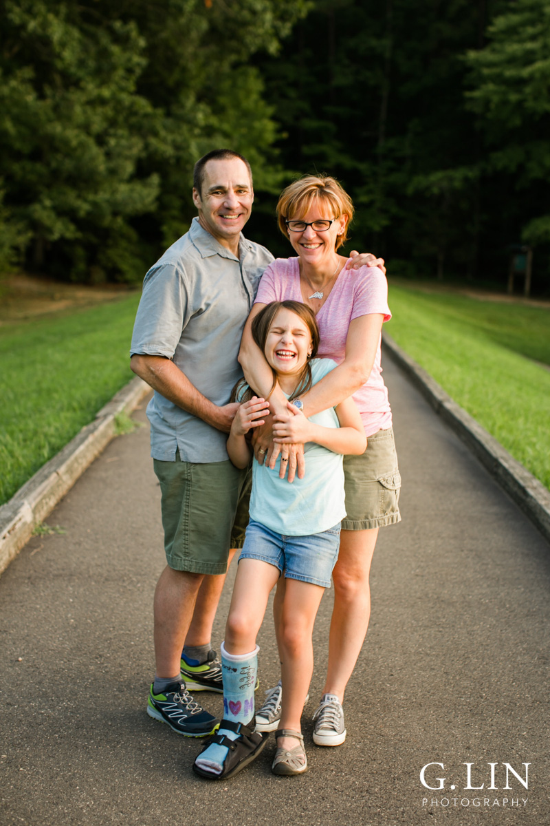 Raleigh Family Photographer | By G. Lin Photography | Family laughing candidly outside