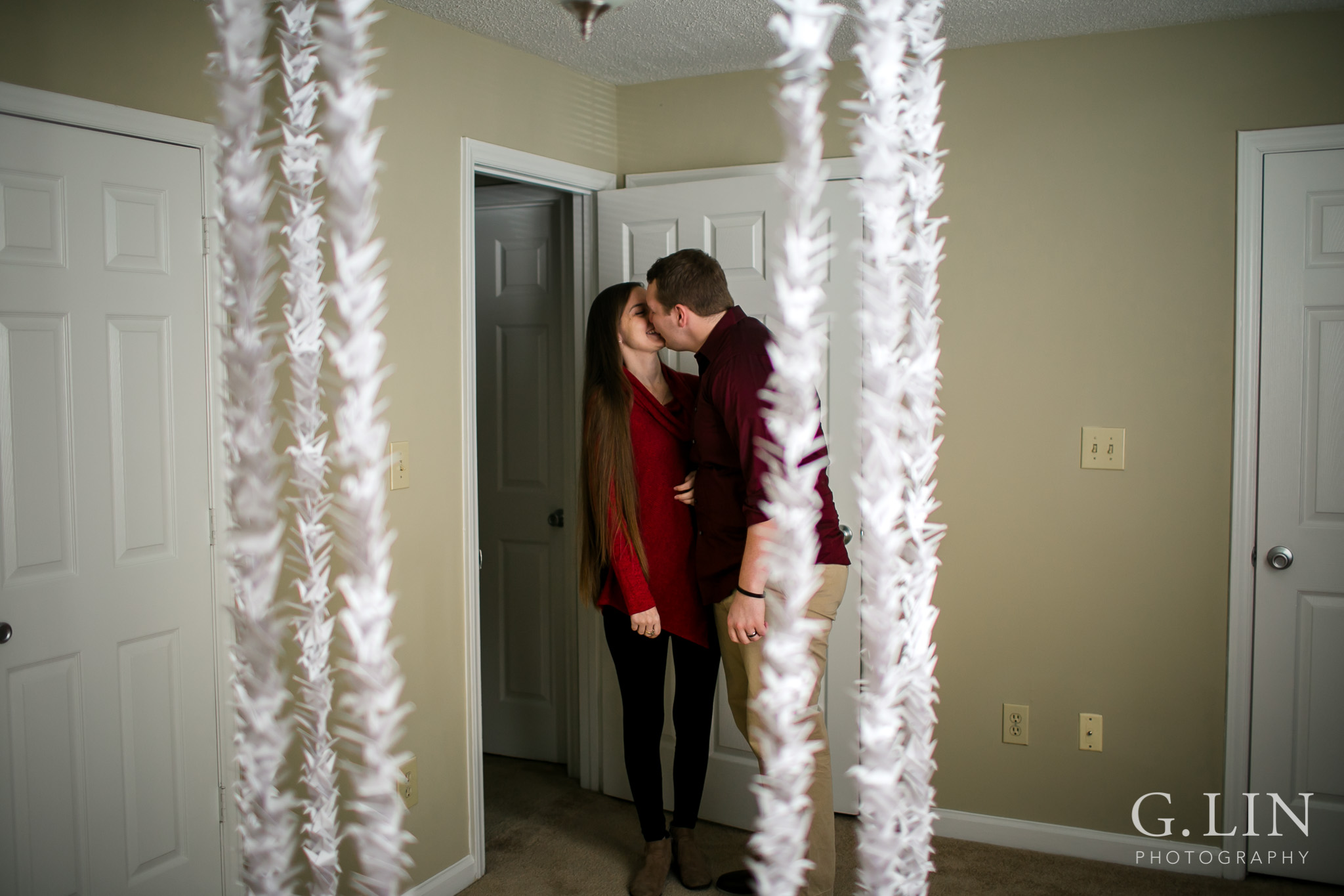 Couple kissing during surprise proposal | Raleigh Engagement Photographer | By G. Lin Photography