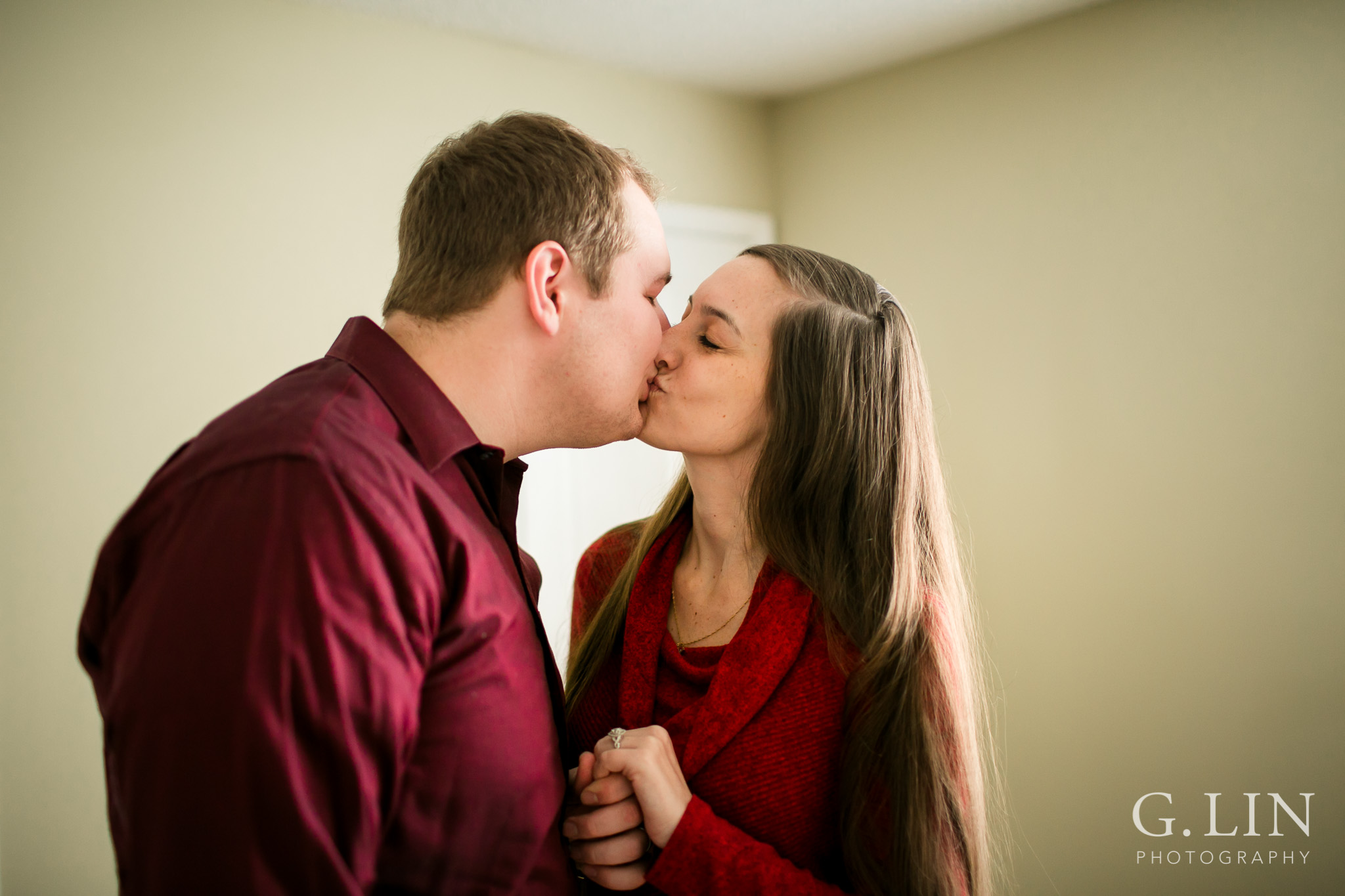 Couple kissing at home | Raleigh Engagement Photographer | By G. Lin Photography