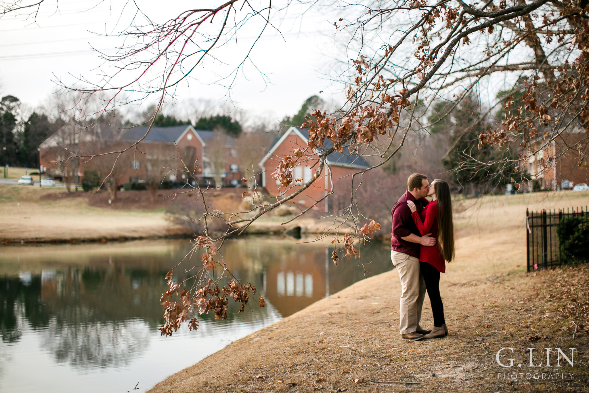 Winter engagement photo outside by tree | Raleigh Engagement Photographer | By G. Lin Photography