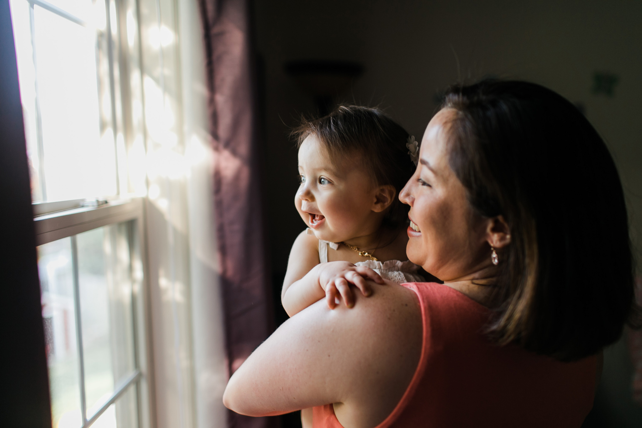 Mother and daughter looking out window | Raleigh Baby Photographer | By G. Lin Photography