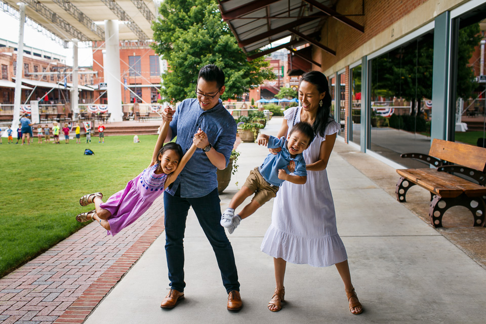 Parents swinging children | Downtown Durham Photography | By G. Lin Photography